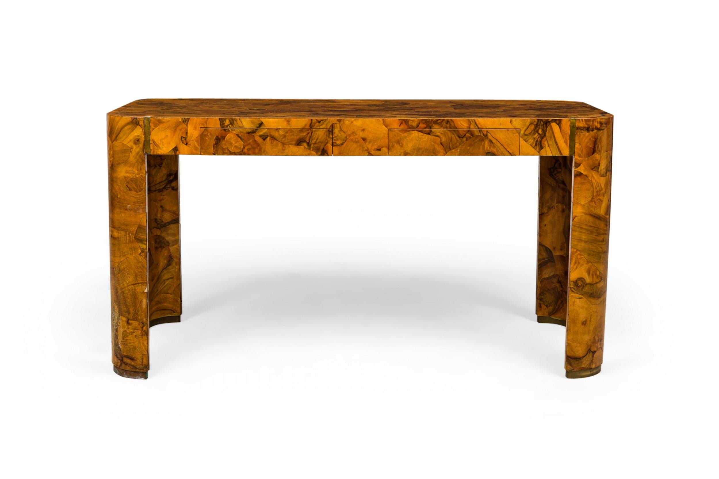 Italian Mid-Century 'Raidus' writing desk with a rectangular top with rounded edges and two drawers, finished in oyster burl veneer and resting on four rounded triangular legs.