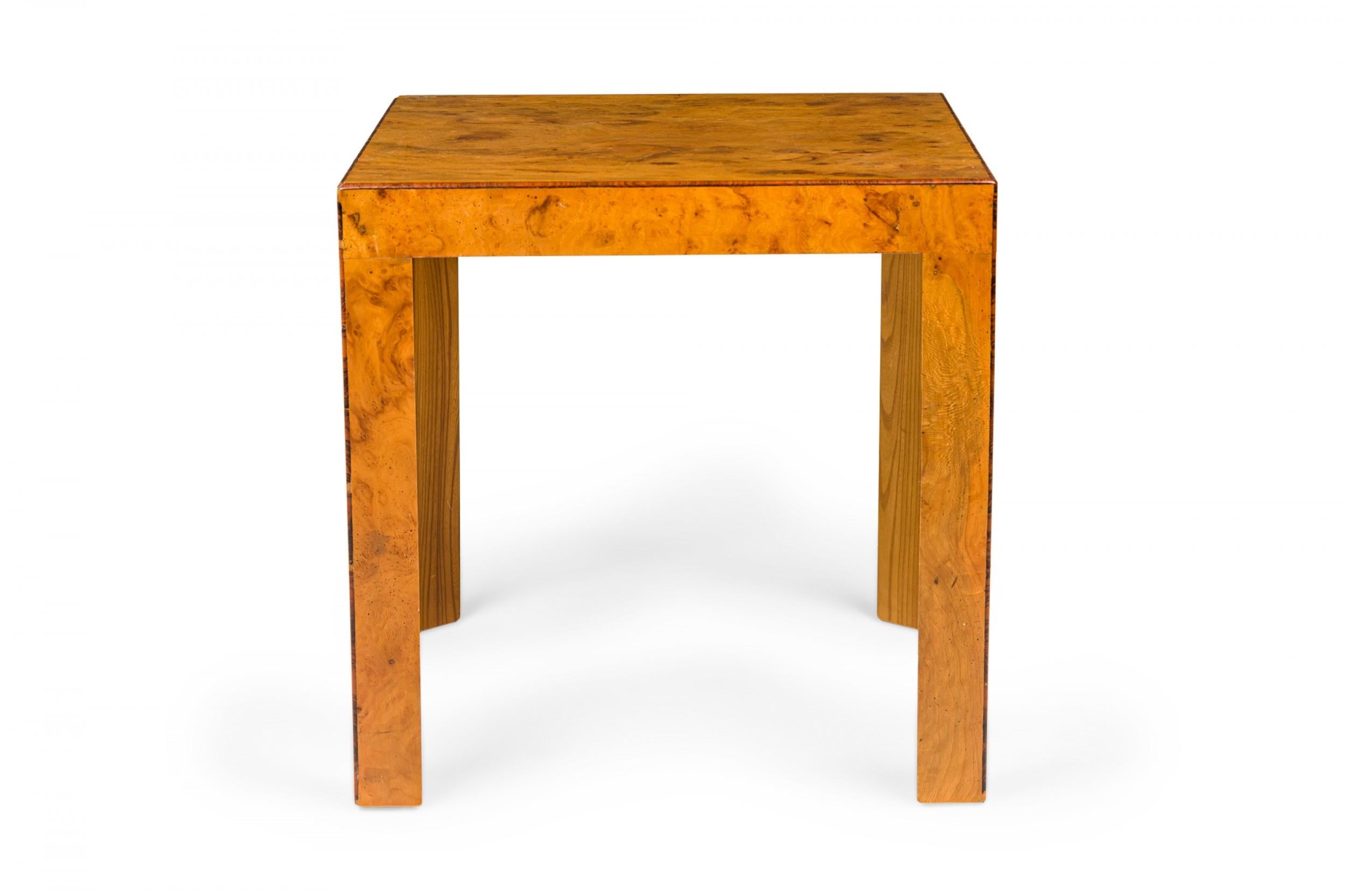 Italian mid-century square end / side table with an oyster burl veneer, resting on four triangular legs.
     