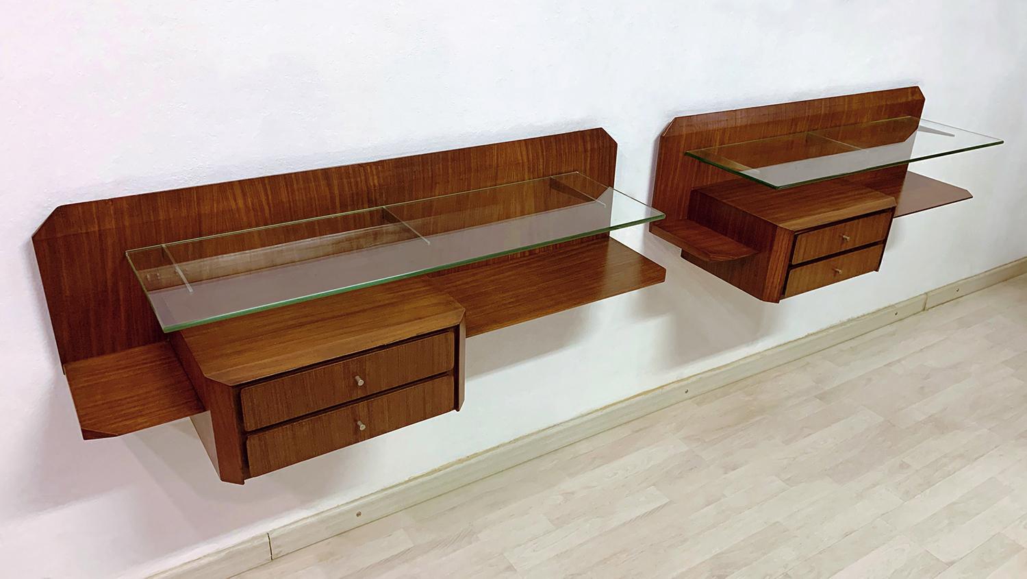 Stunning pair of Italian floating wall teakwood console, with drawers and glass shelves, attributed to Gianni Moscatelli in the 1960s.
Both item are in good conditions of the period as the images show, with slight signs of wear consistent with age