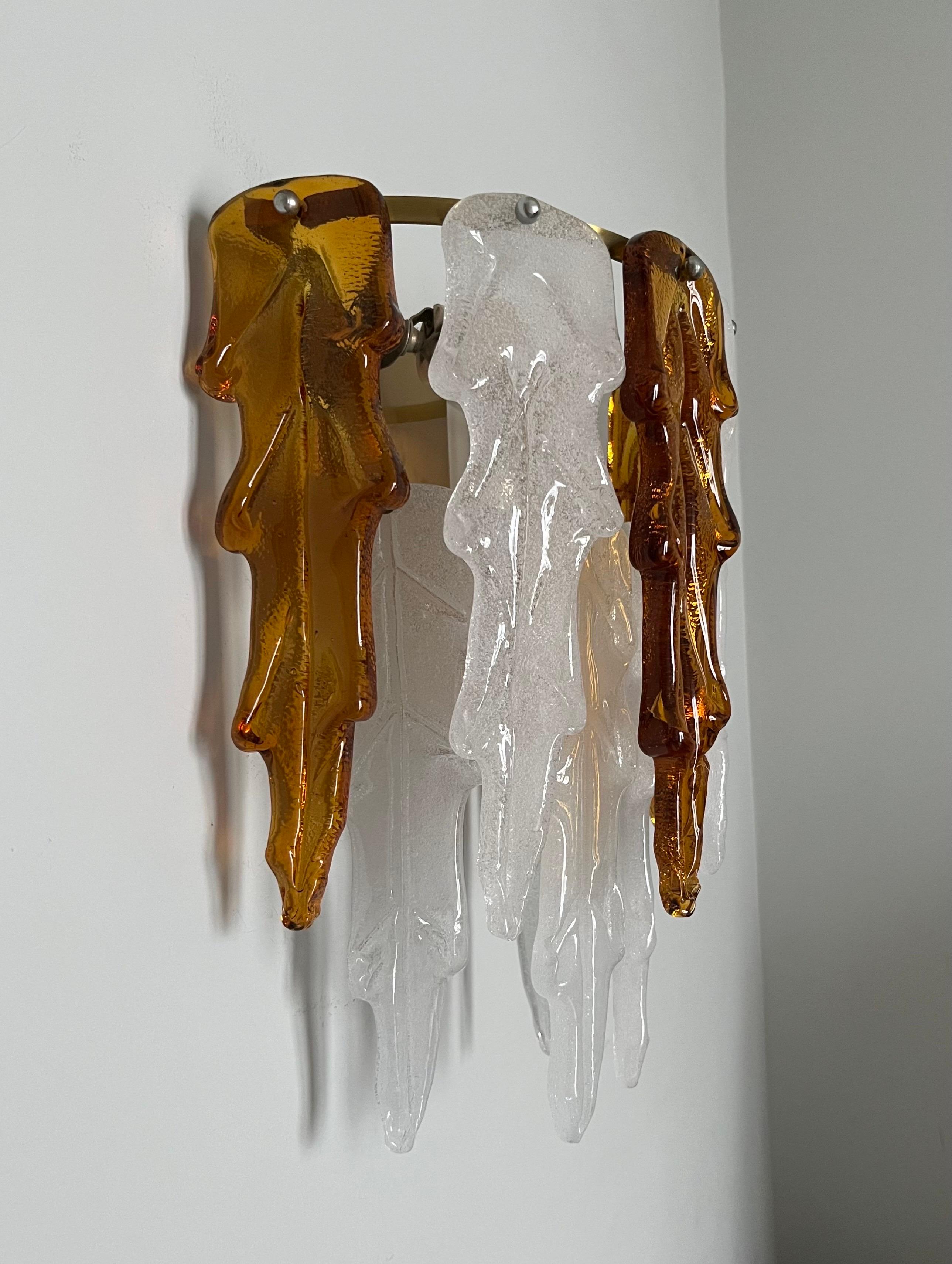 Unique, beauty and large Pair of Italian white amber Murano glass wall sconces from 1970s.
These wall sconces were made during the 1970s in Italy for the Venice Company 