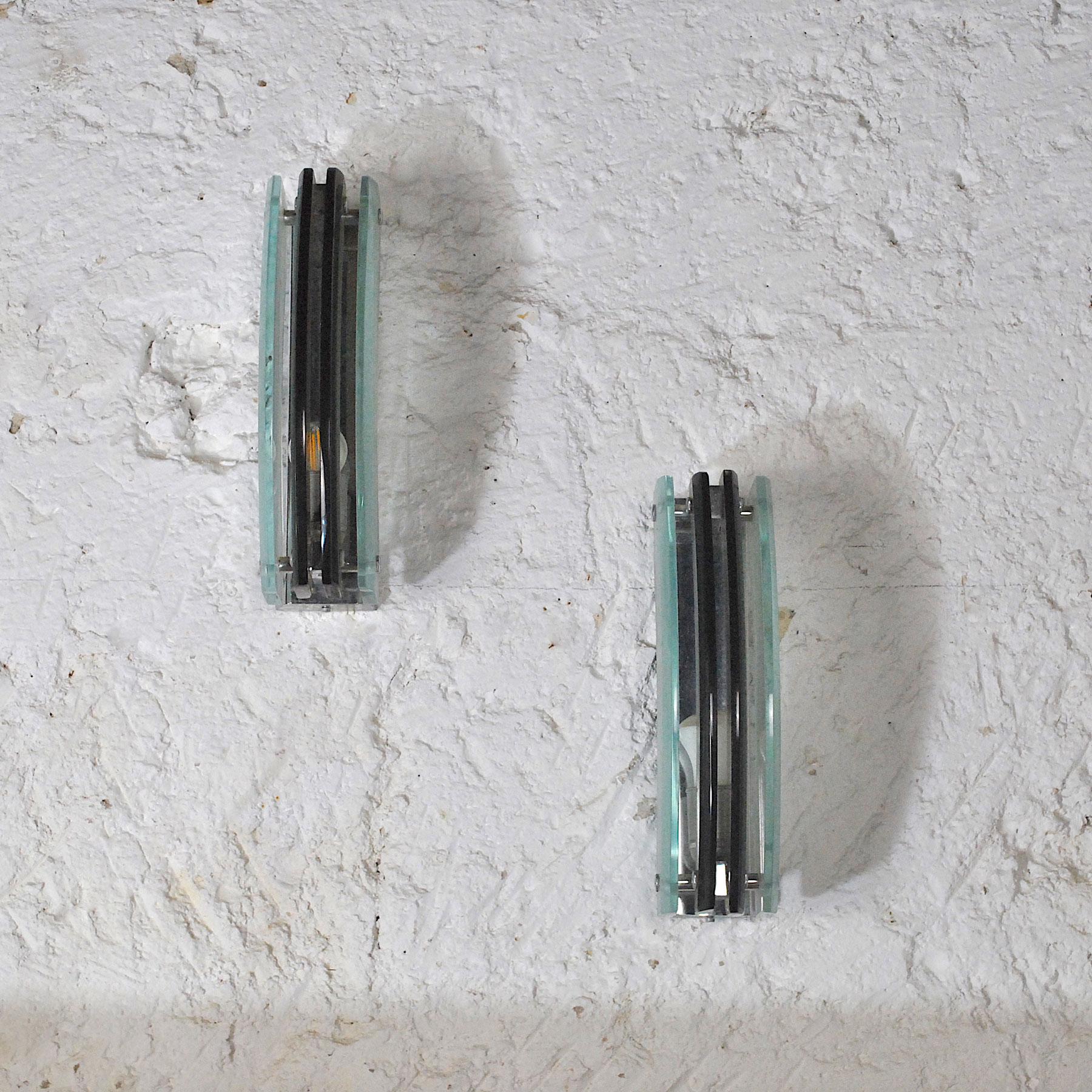 Pair of wall lights in the style of Fontana Arte.