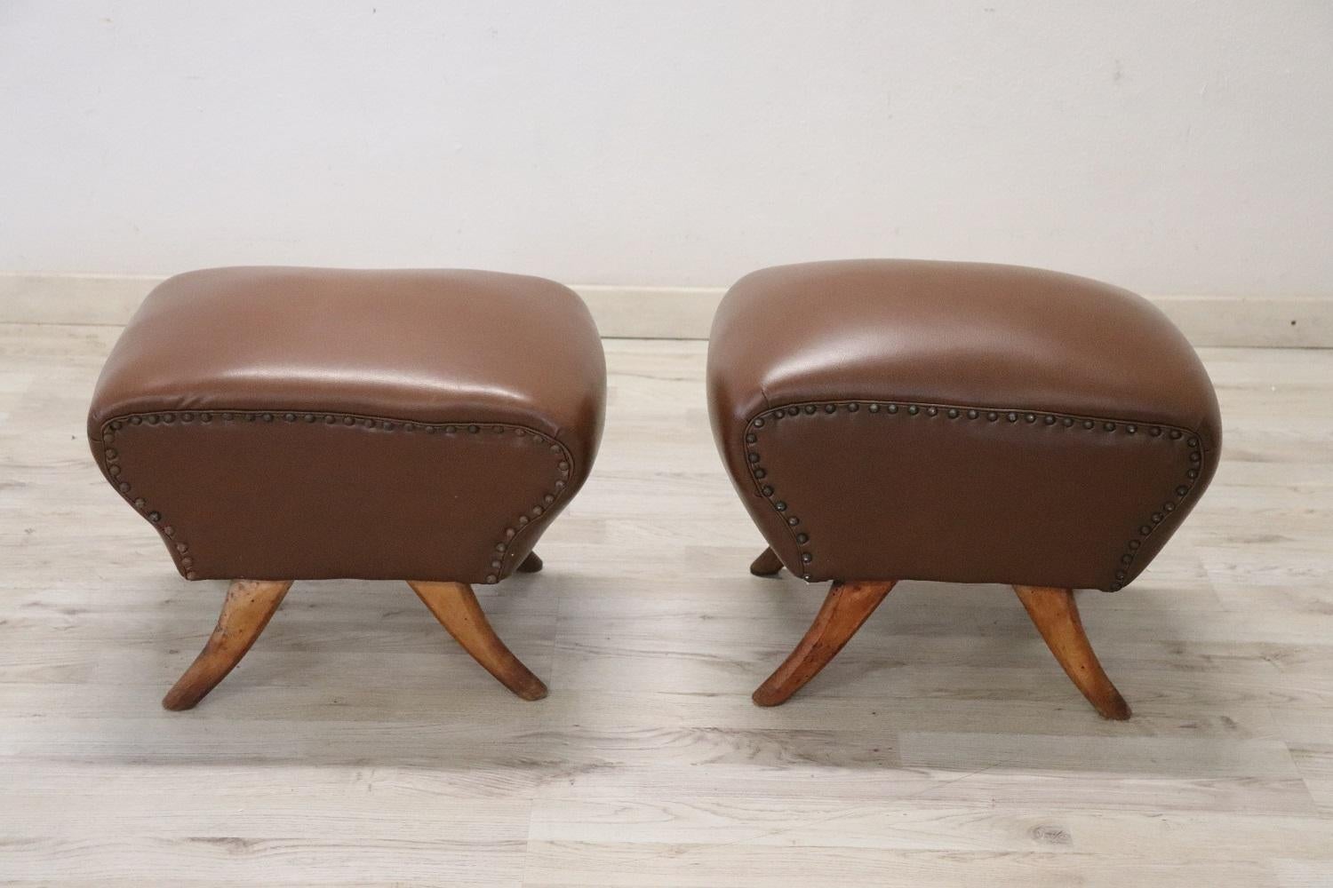 Beautiful italian mid-century pair of stools with a brown faux leather. These loving stools have a comfortable seat. Vintage good conditions. Perfect conditions of padding and faux leather.