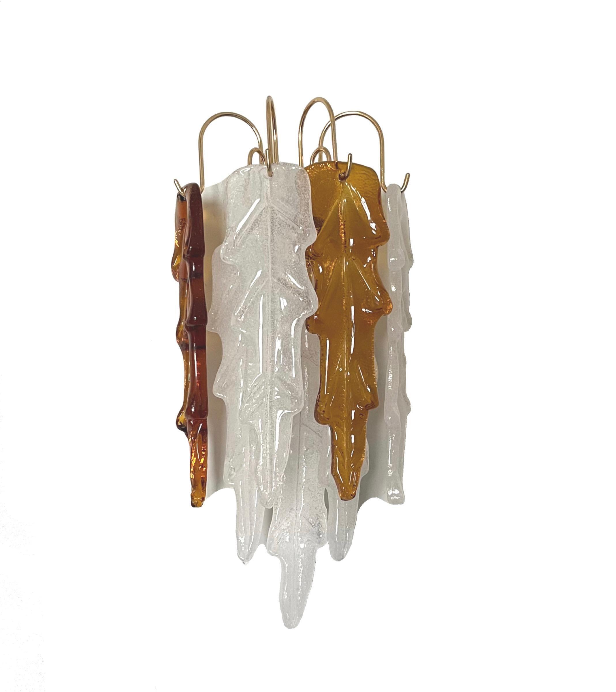 Unique and beauty Pair of Italian white amber Murano glass Wall Sconces from 1970s.
These Wall Sconces were designed and manufactured during the 1970s in Italy for the Venice Company 