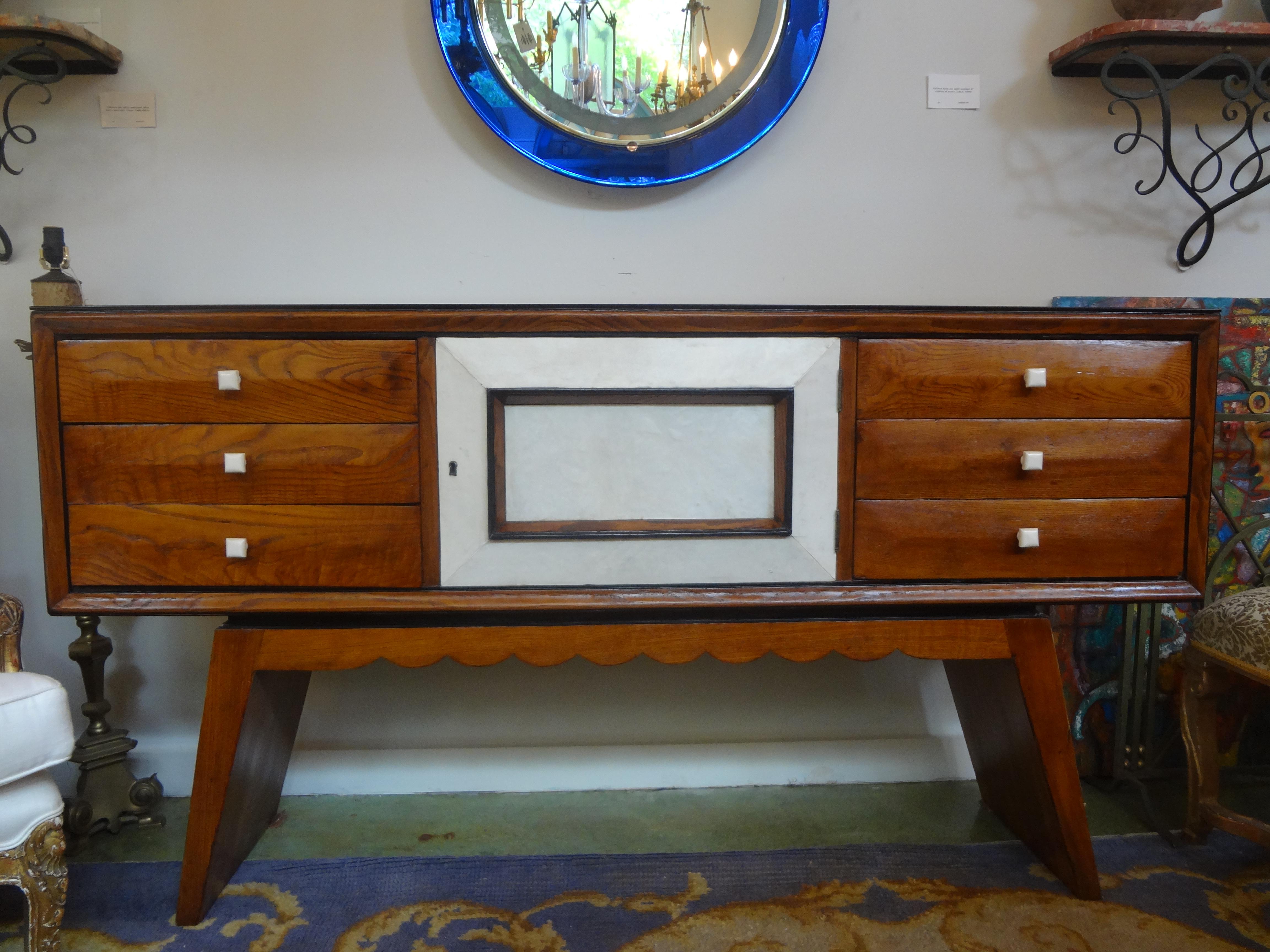 Italian Mid-Century Wood and Shagreen Credenza or Commode After Paolo Buffa.
Mid-century Italian wood and shagreen/parchment credenza, commode, chest or console table inspired by Paolo Buffa. Our Italian Brutalist style credenza is comprised of a