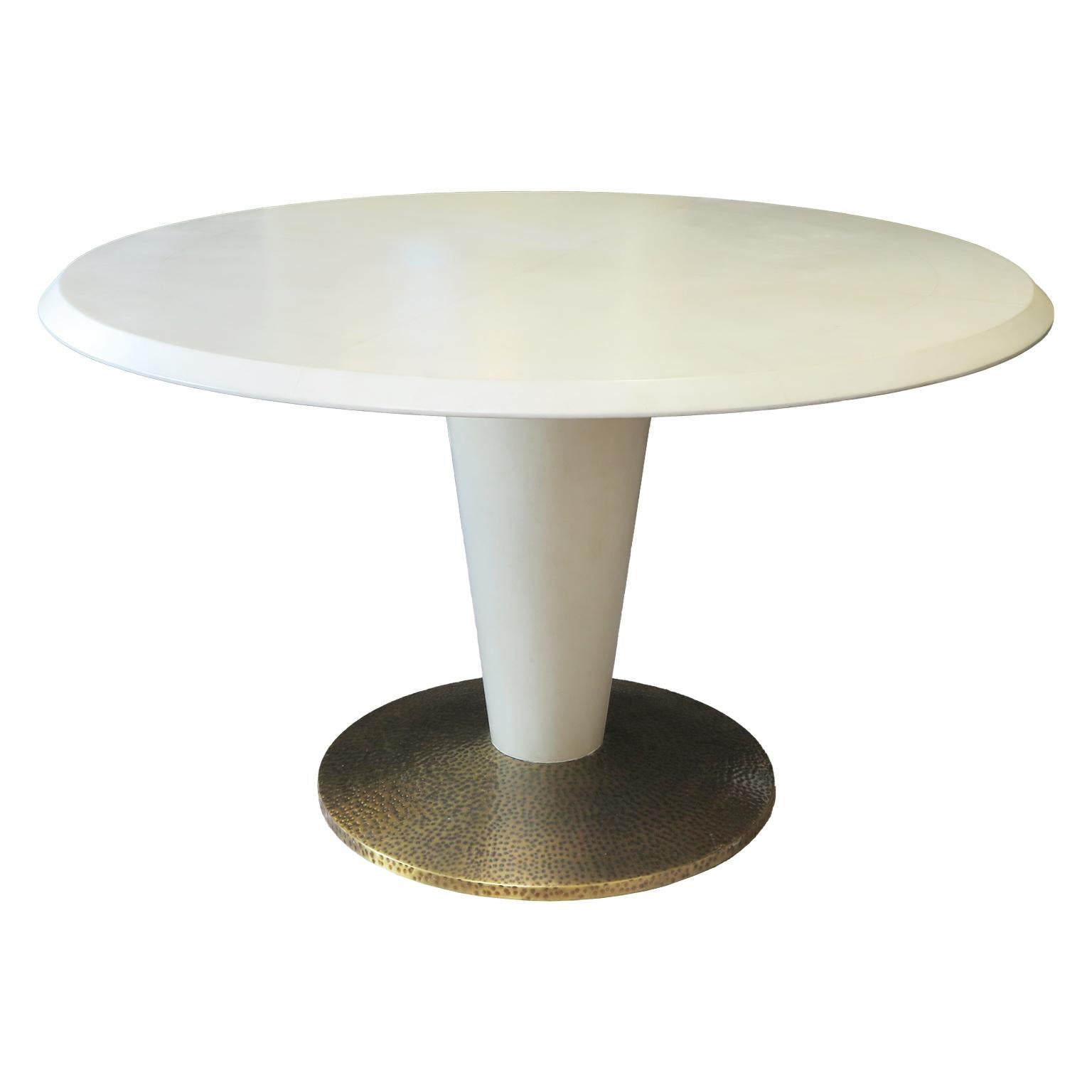 This Italian Mid-Century table is done in a faux Parchment look with a hand applied lacquer technique. The top is divided into four sections with an ivory, slightly aged yellow tint evoking the feel of parchment. The table showcases a tapered stem