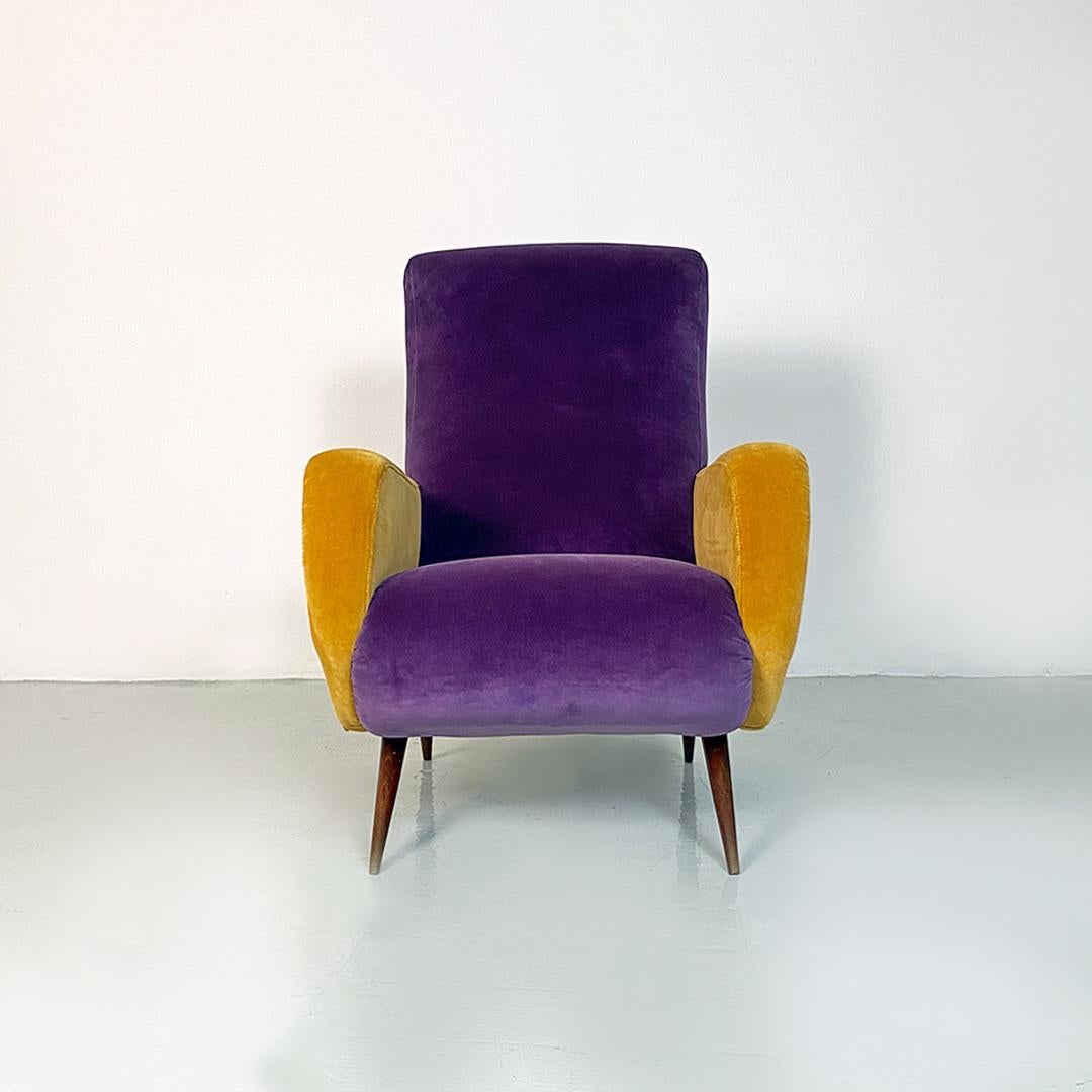 Italian mid century modern purple and yellow armchair with wood conical legs, 1960s
Funny but elegant armchair with beech shell fully padded and upholstered in purple velvet on the seat and back and in yellow velvet on the armrests. Conical wooden