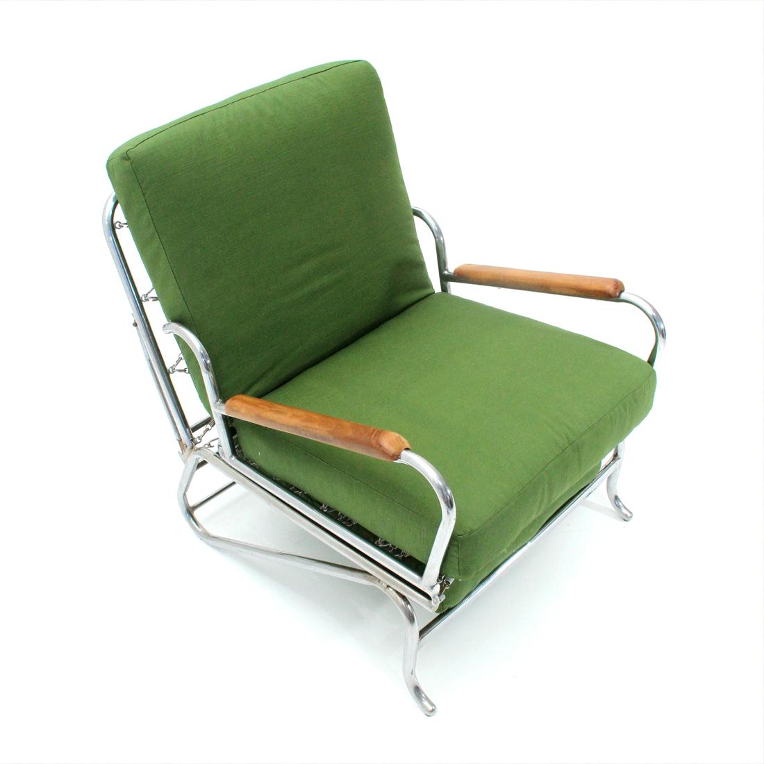 Italian manufacturing armchair produced in the 1930s.
Chromed metal tubular structure.
Cushions padded and lined with new green fabric.
Armrests in shaped wood.
Adjustable backrest in different positions and armchair that can be transformed into