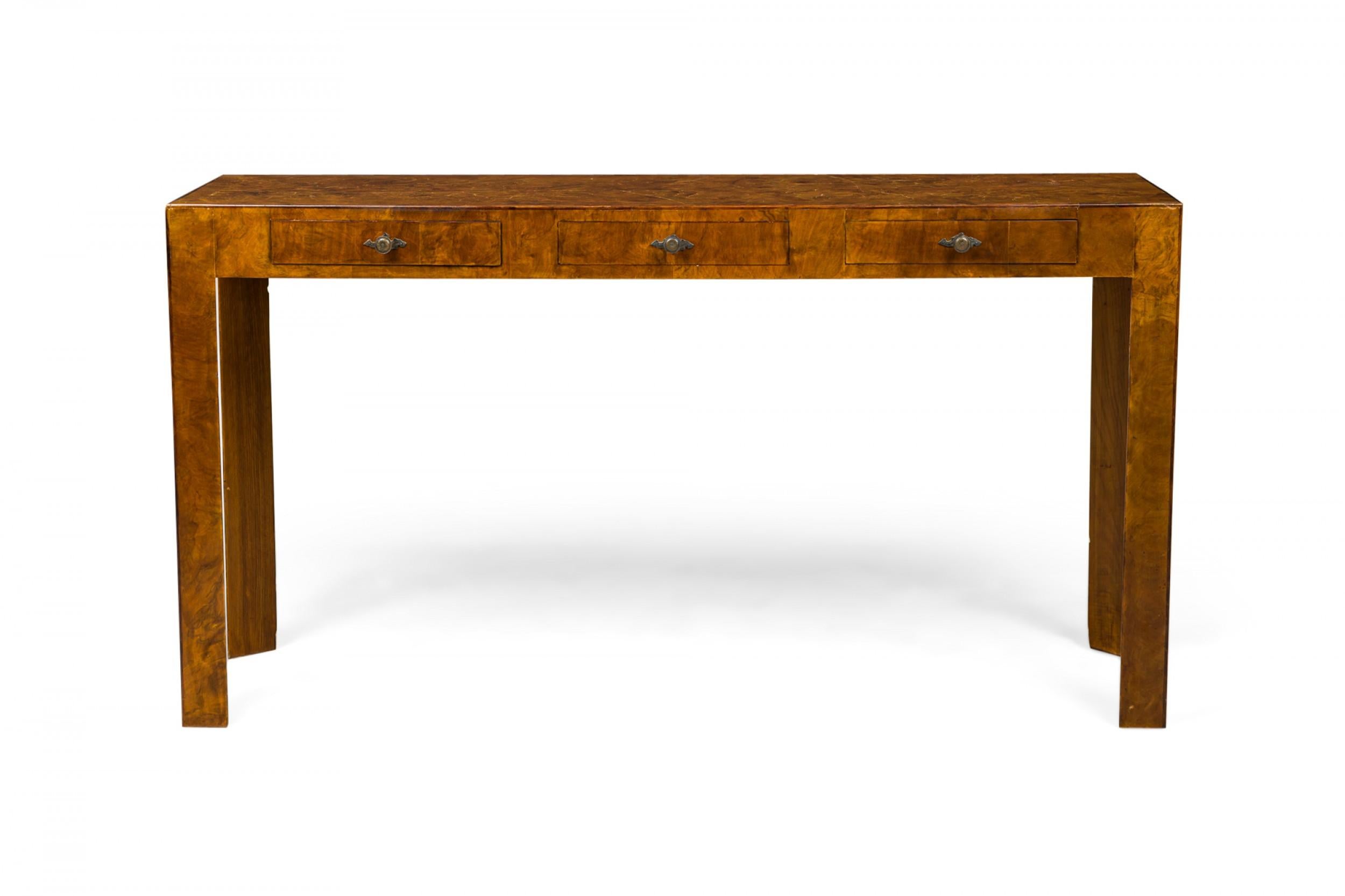 Italian Mid-Century rectangular console table with oyster burl veneer and three drawers with bronze drawer pulls, resting on four triangular legs.
