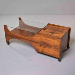 Mesa de centro italiana de mediados de siglo, de palisandro, con tapa de cristal y compartimento de almacenamiento con tapa abatible