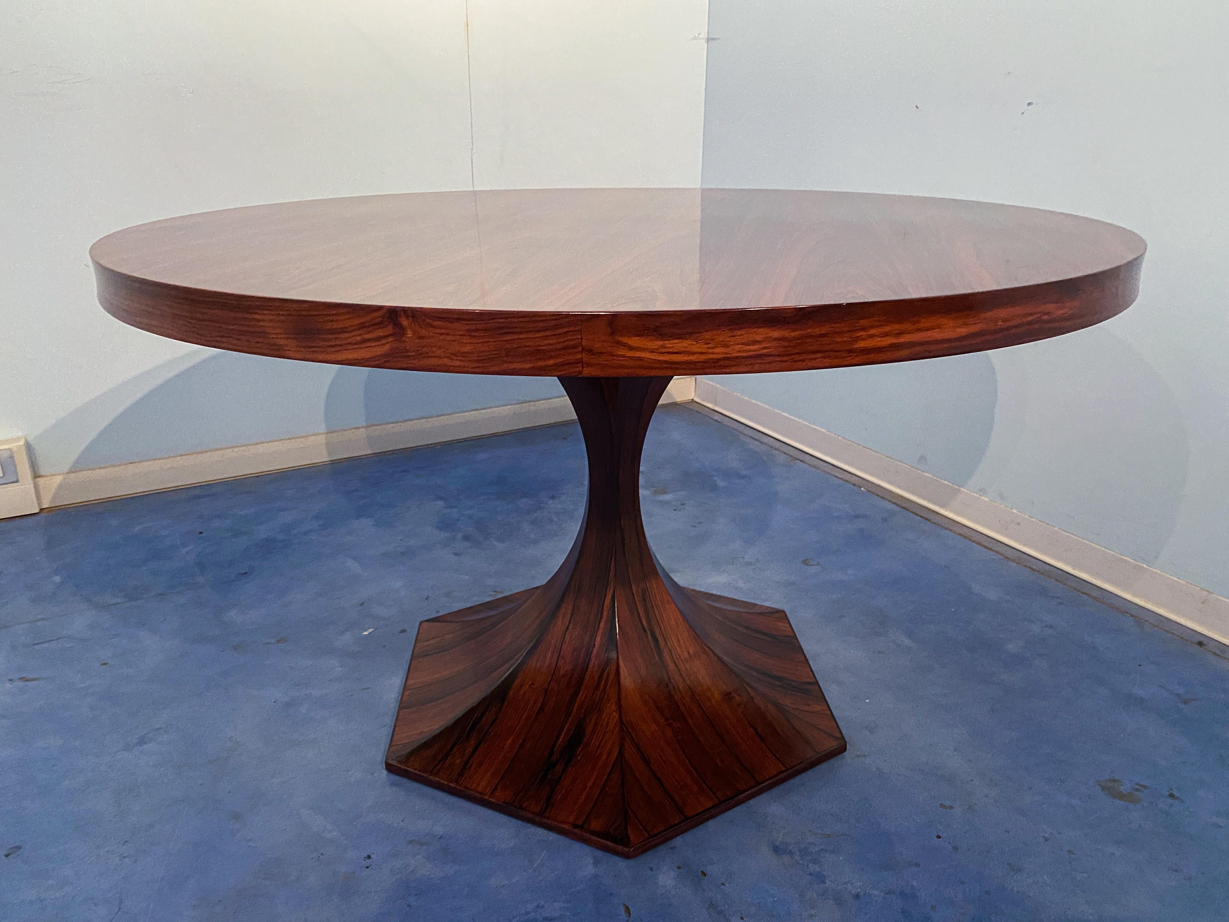 Dating back to the mid-1900s, this exquisite piece of furniture is a true marvel of Italian design. Designed by Giulio Moscatelli, circa 1964, made by Meroni, this table is a perfect blend of elegance and functionality. Crafted entirely in rich