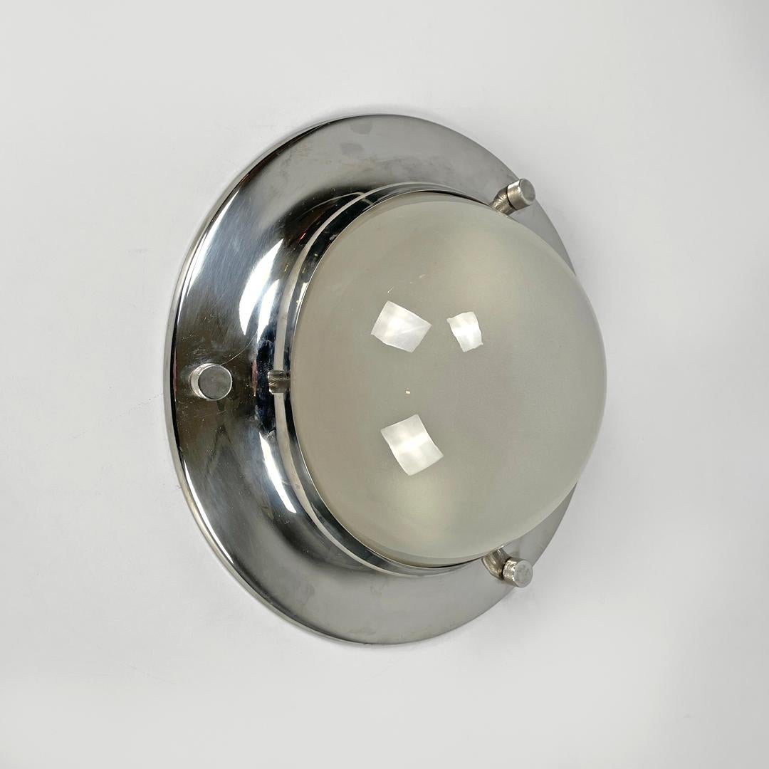 Italian mid-century round wall lamp LSP6 Tommy by Caccia Dominioni Azucena 1960s
Wall lamp or applique mod. LSP6 Tommy with round base. The structure is in chromed metal, on the edge there are three bolts. The semi-spherical lampshade is in