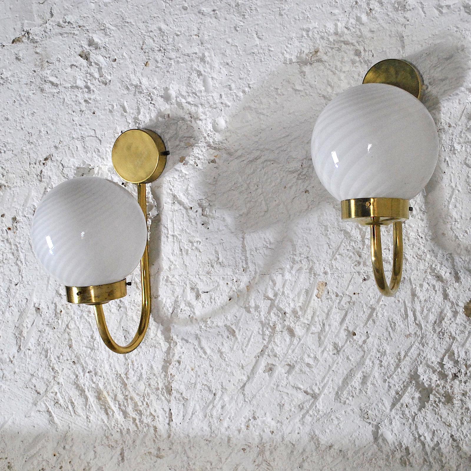 A pair of sconces from the 1960s by Veart Italian production in brass and opaline.