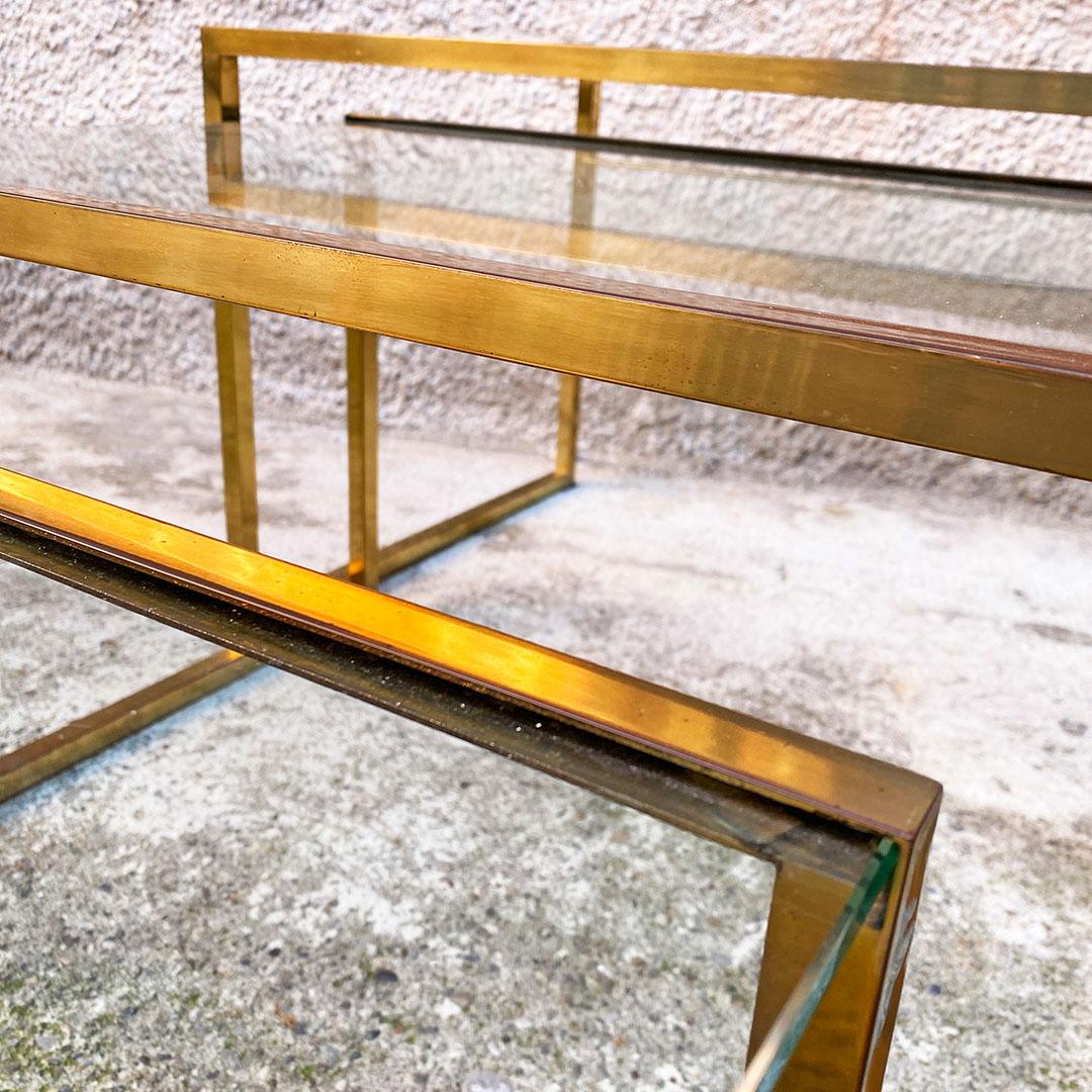 Italian mid century set of three brass and aquamarine glass stackable tray table, 1950s
Set of three stackable coffee tables with square section brass side structures, in which the aquamarine green glass top fits.
About 1950s.
Good