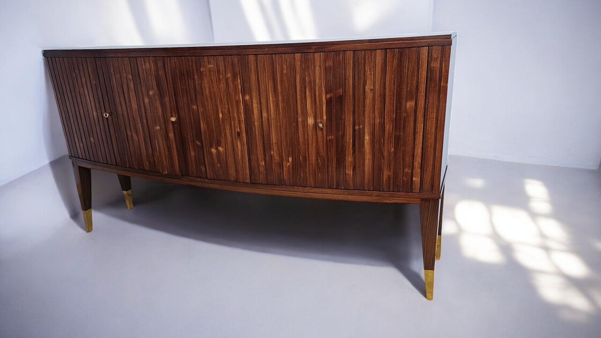 Italian Mid Century Sideboard attributed to Paolo Buffa in solid Indian Rosewood,the front has five doors and a beautiful 
