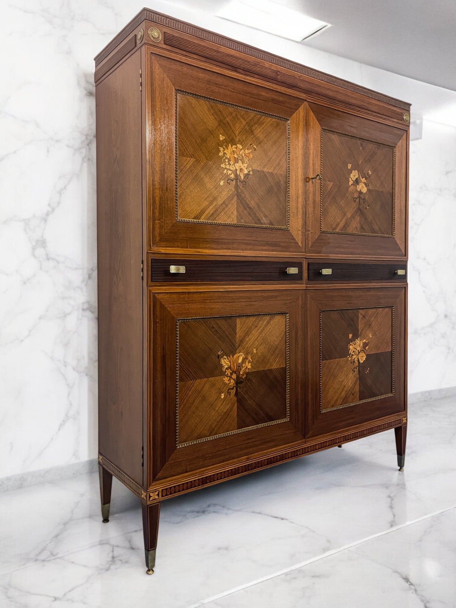 Presenting this stunning Italian sideboard with a bar compartment, crafted in the 1950s by Marelli & Colico and so well designed by professor and architect Paolo Maggi.

Its standout feature lies in the two doors adorned with breathtaking inlays