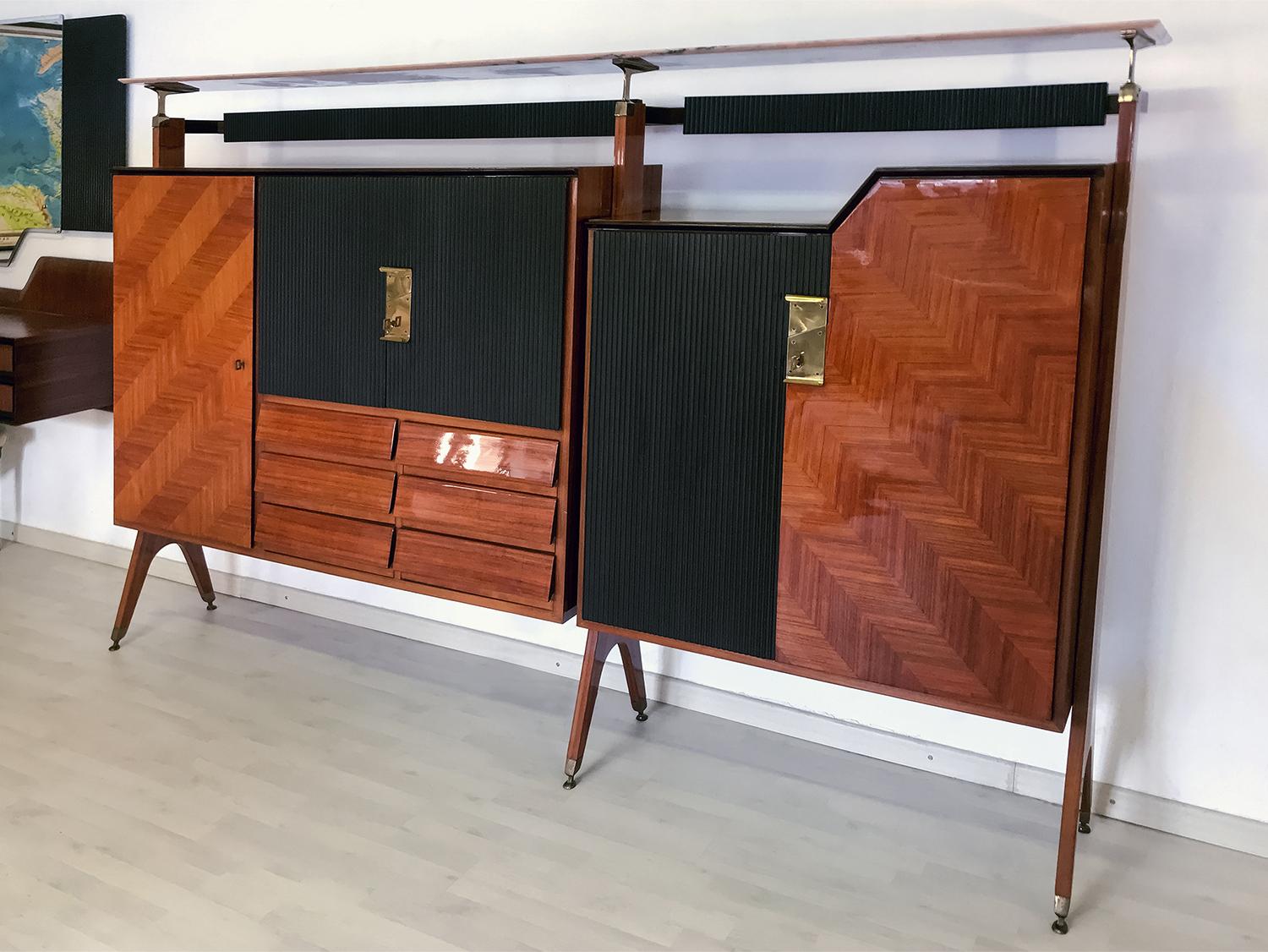 This stunning Italian sideboard is designed by La Permanente Mobili Cantù, and is an expressive piece of the midcentury italian design manufactured in the 1950s.

It’s uniqueness is given by the unusual sculptural shape design of the cabinets made