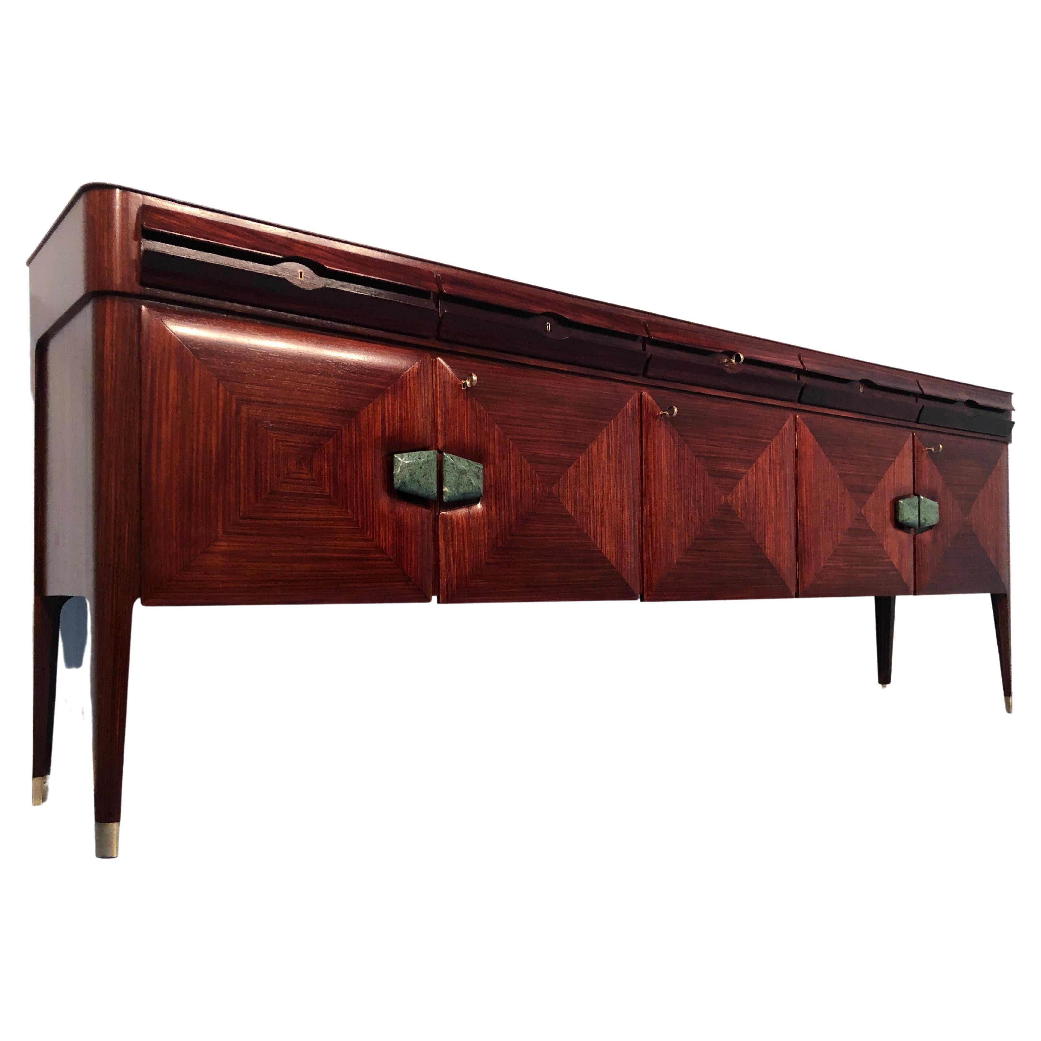Stylish Italian mid-century sideboard made by Vittorio and Plinio Dassi per La Permanente Mobile di Cantù in the 1950s. Glass top, green marble handles from Alpi. Feet finish with brass sabot. It has five drawers with a unique style. The interiors