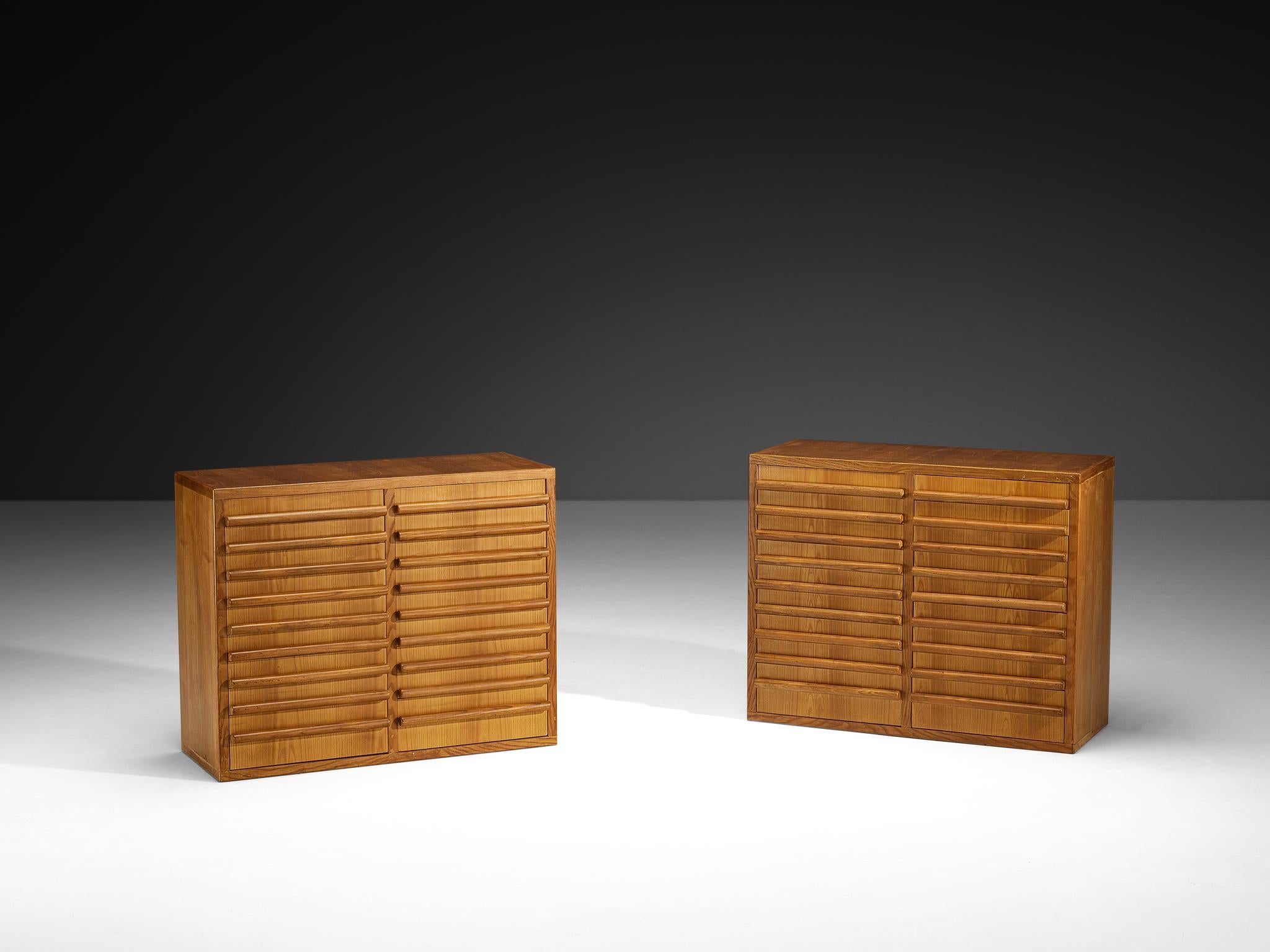Sideboards, ash, Italy, 1960s

These stunning sideboards, crafted in Italy during the 1960s, embody a clean, modern sensibility with thoughtful proportions and elegant simplicity. Executed in warm ash wood, their horizontal rhythm is defined by