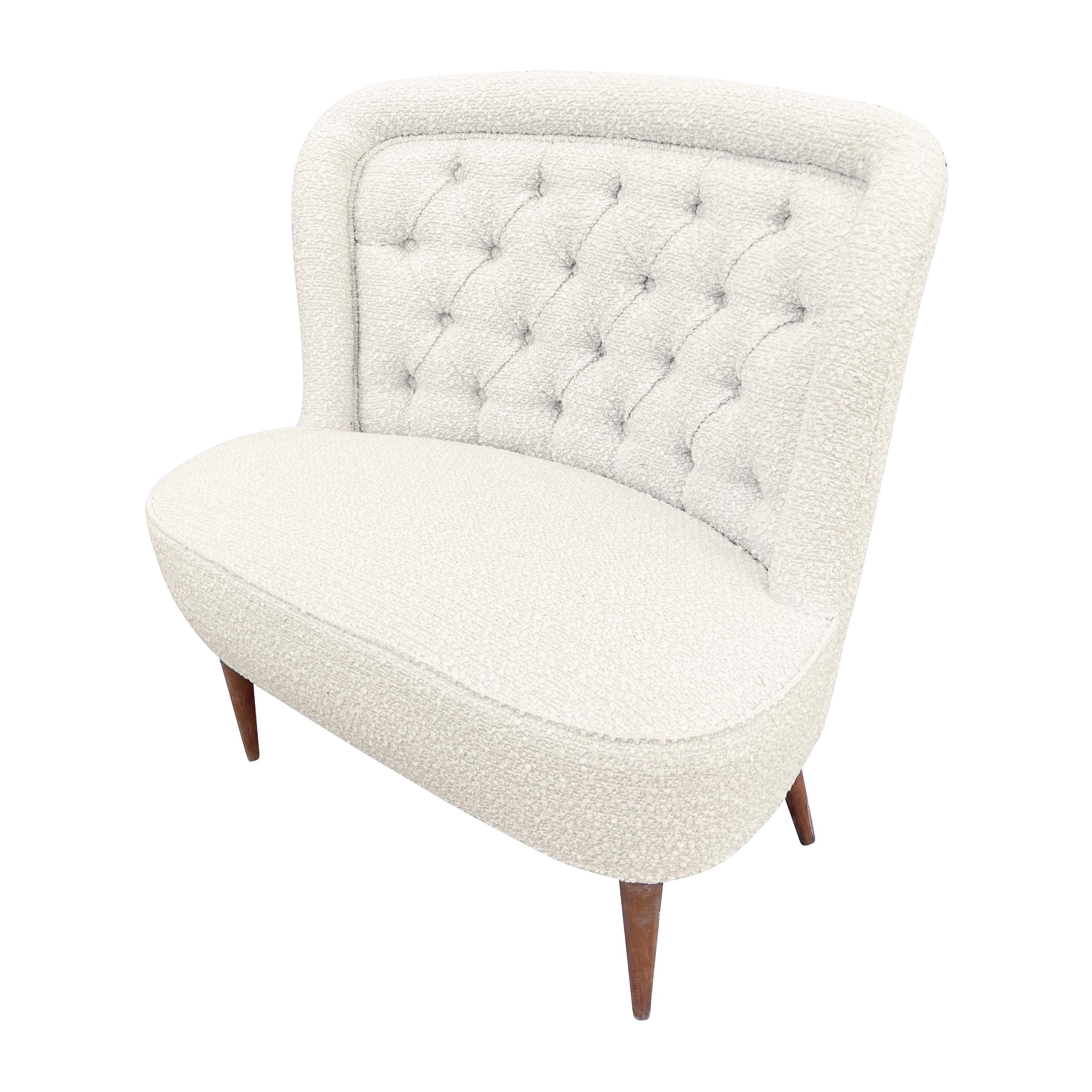 Italian midcentury slipper chair
$2,900.00
Italian midcentury slipper chair with a tufted back and wood legs. Recovered in an off-white bouclé.

Condition: Minor wear consistent with age and use. Recently recovered.

Measures: width: