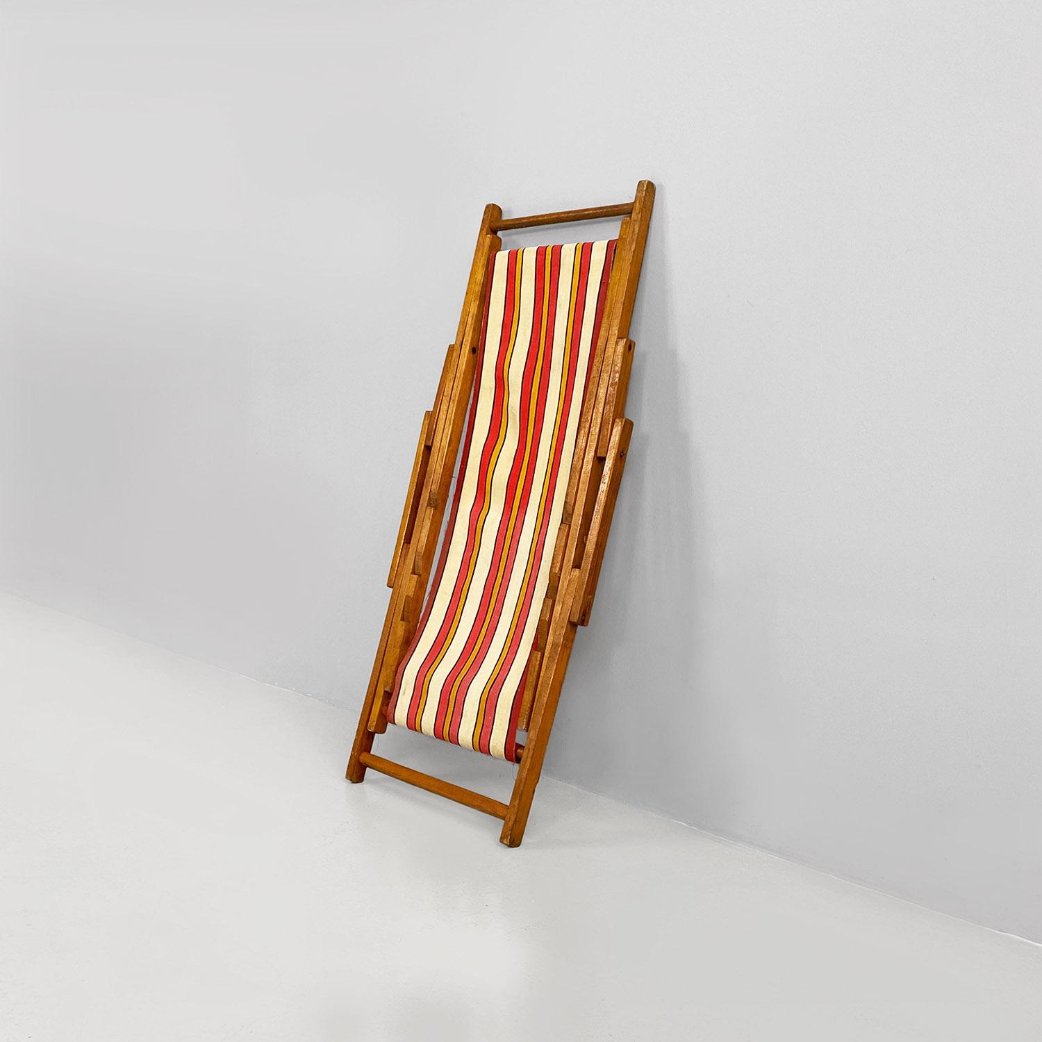 Italian mid-century small wooden and original colored fabric deckchair, 1950s
Children's deckchair with wooden structure and seat in red, yellow and beige colored striped fabric.
1950s
Good conditions.
Measurements in cm 90x50x80h
Variable sizes
