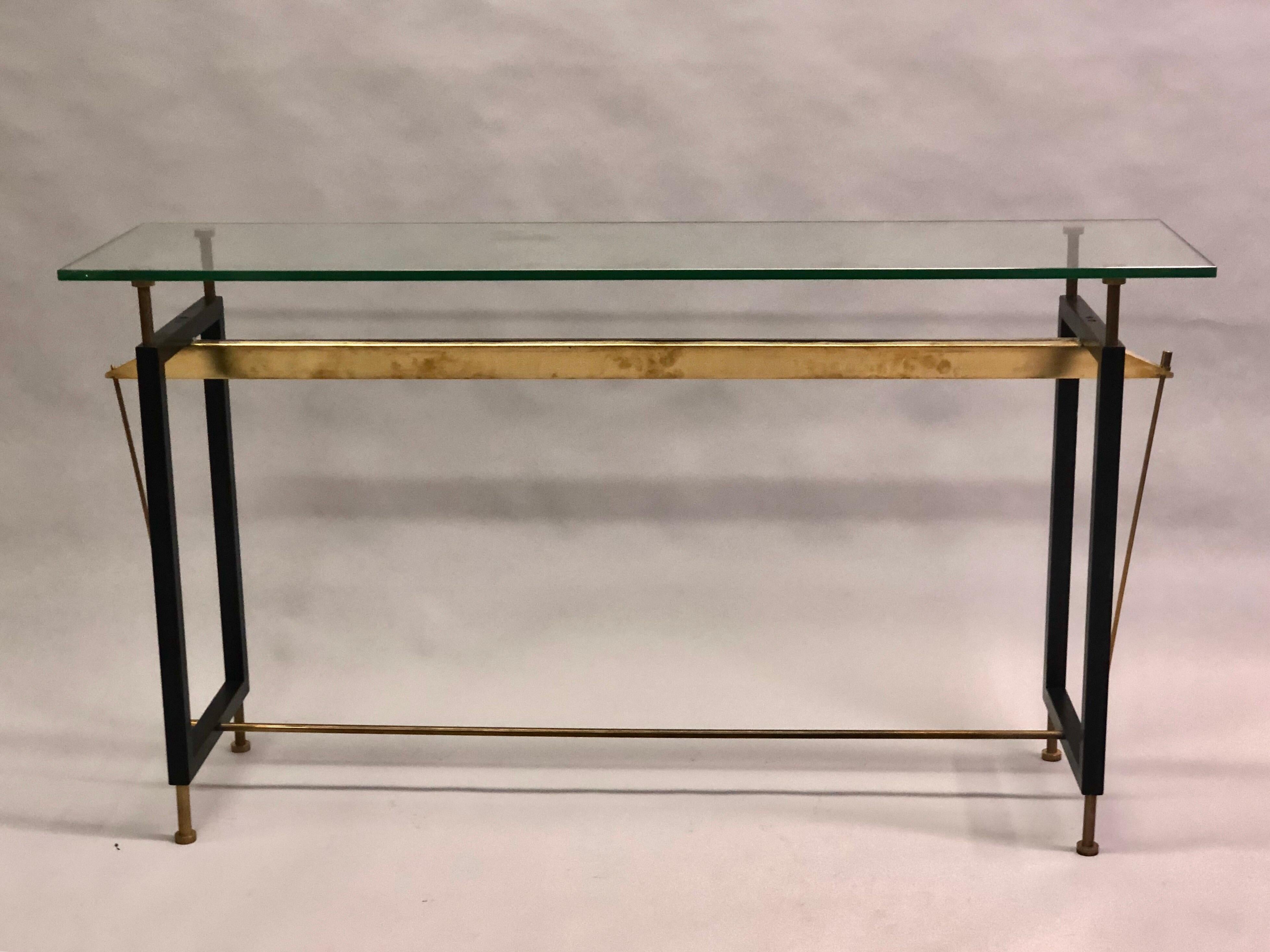 Italian Mid-Century Modern enameled steel, brass and glass cantilevered console Attributed to Franco Albini and Franca Helg.

The console / sofa table is elegantly conceived with a balance of stunning angles and details that are view-able from any