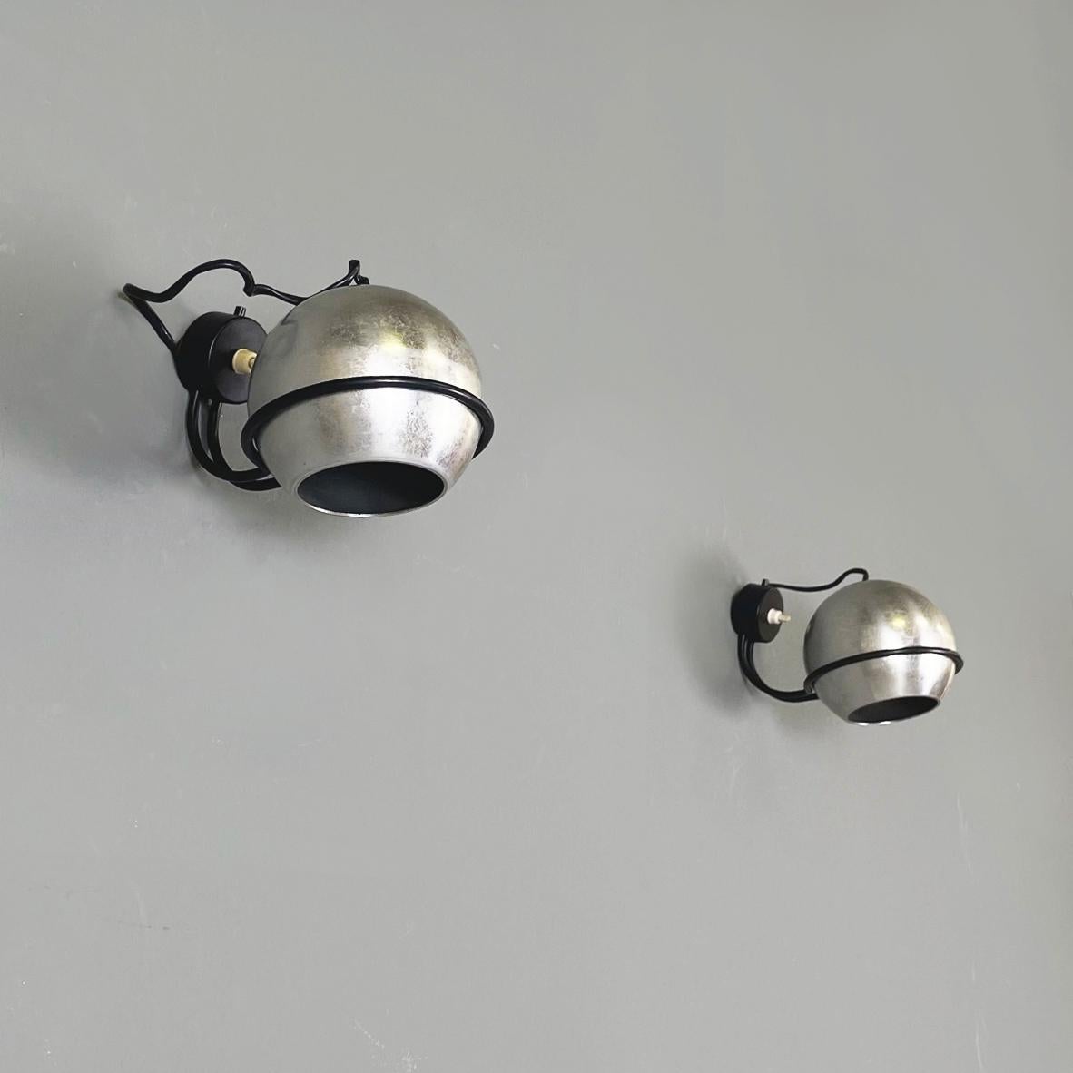Italian mid-century modern steel Wall light nr. 232 by Gino Sarfatti for Arteluce, 1960s
Pair of wall lights mod nr. 232 with a round metal base. The spherical steel diffuser is supported by a black painted metal rod structure. The switch is located