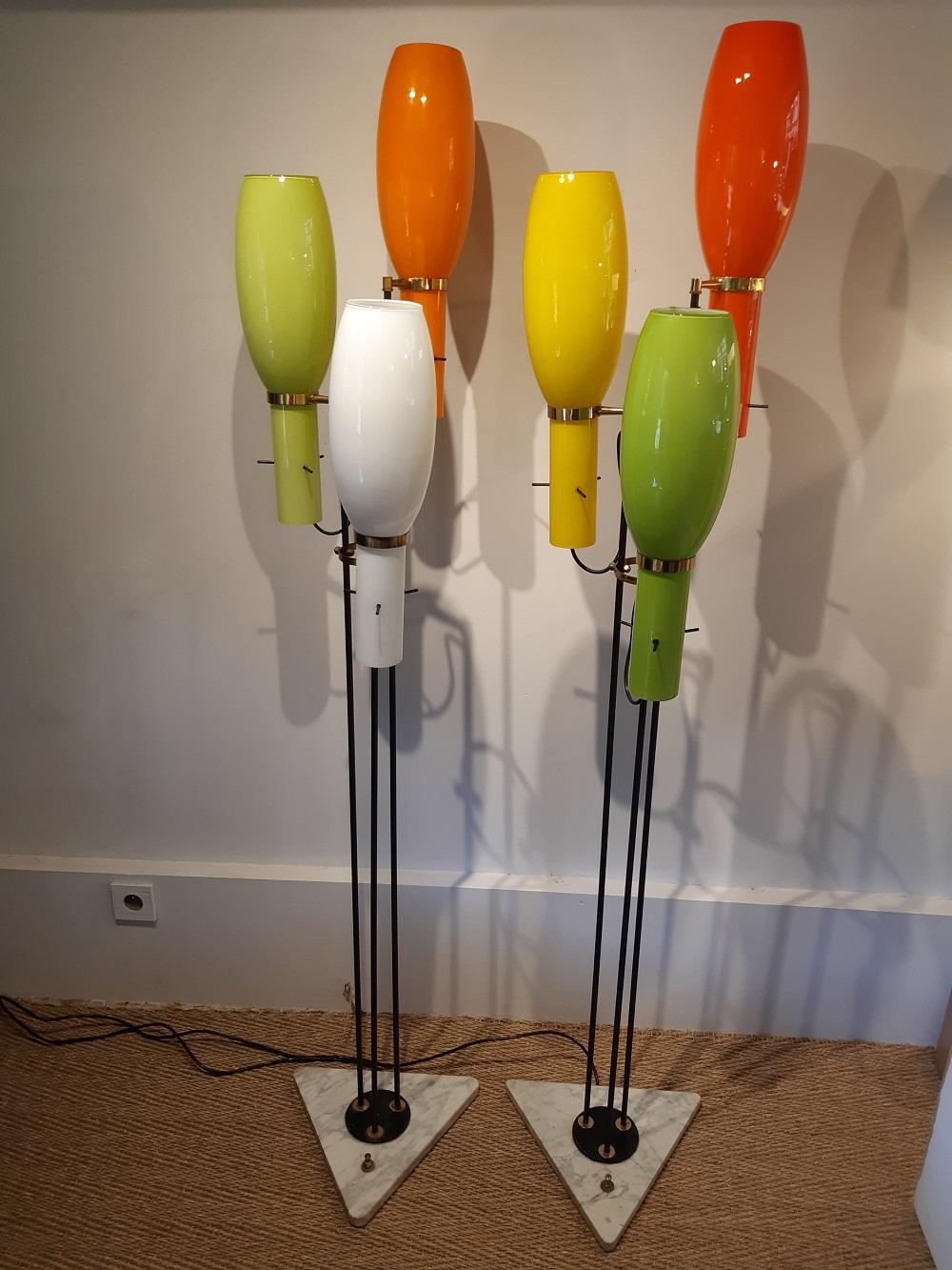 Italian midcentury Stilnovo floor lamp 1950s metal, glass and marble.
Switch on the marble base.
There is a pair available, the price is for one
Both are different. There is one with 3 pale colors: white, green and orange.
On the other floor