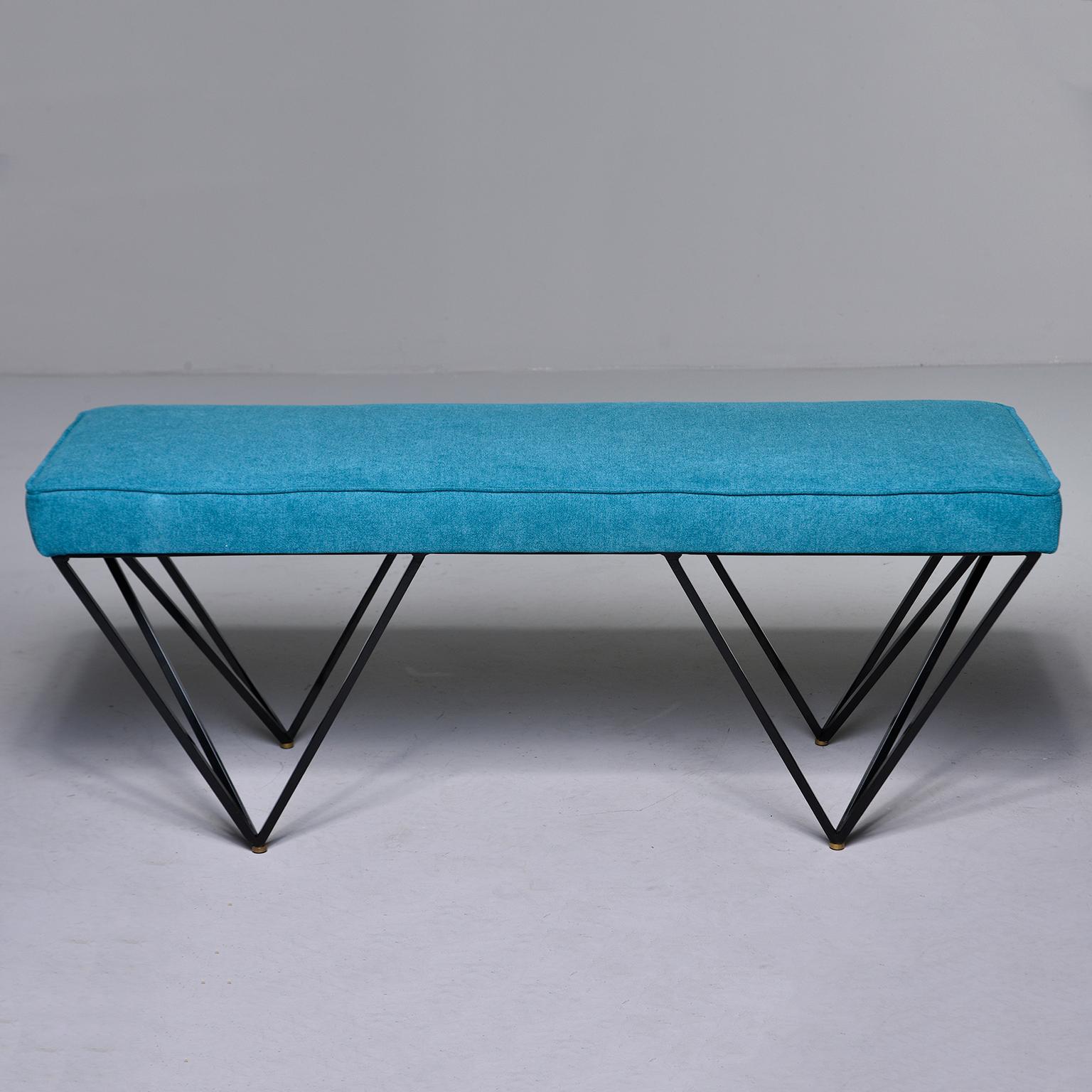 Italian midcentury style bench has black enameled metal base with open triangular form legs and brass feet. Upholstered in teal green chenille. Unknown maker.
