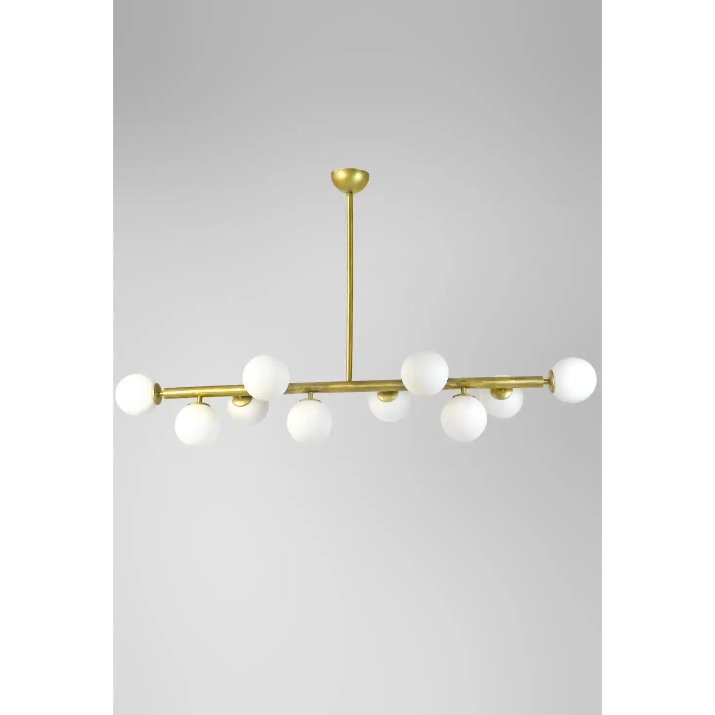 Italian mid-century style brass chandelier featuring 12 globes lights made of opaline glass on a brass vintage treated structure. 

This chandelier listing is for a 12 globes light. Also 16 globes available, please inquire for pricing. 

This