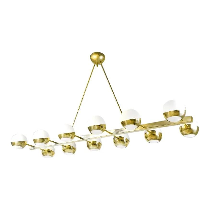 Patinated Italian Mid Century Style Brass Chandelier with 12 glass globe lights For Sale