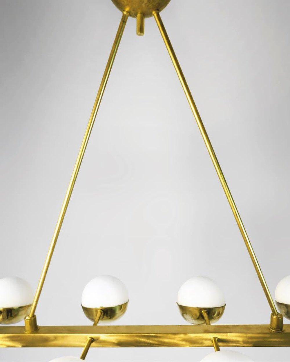 Italian Mid Century Style Brass Chandelier with 12 glass globe lights In Excellent Condition For Sale In Jersey City, NJ