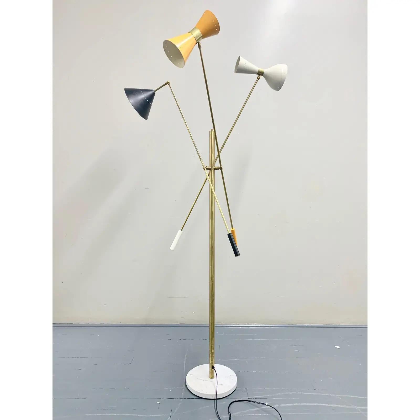 Italian mid-century style floor lamp made in Italy, adjustable, with three different shades and 5 lighting outputs. Multicolor shades: black, yellow, ivory white. Ivory white interiors. Carrara white marble base, arms and body made of solid brass