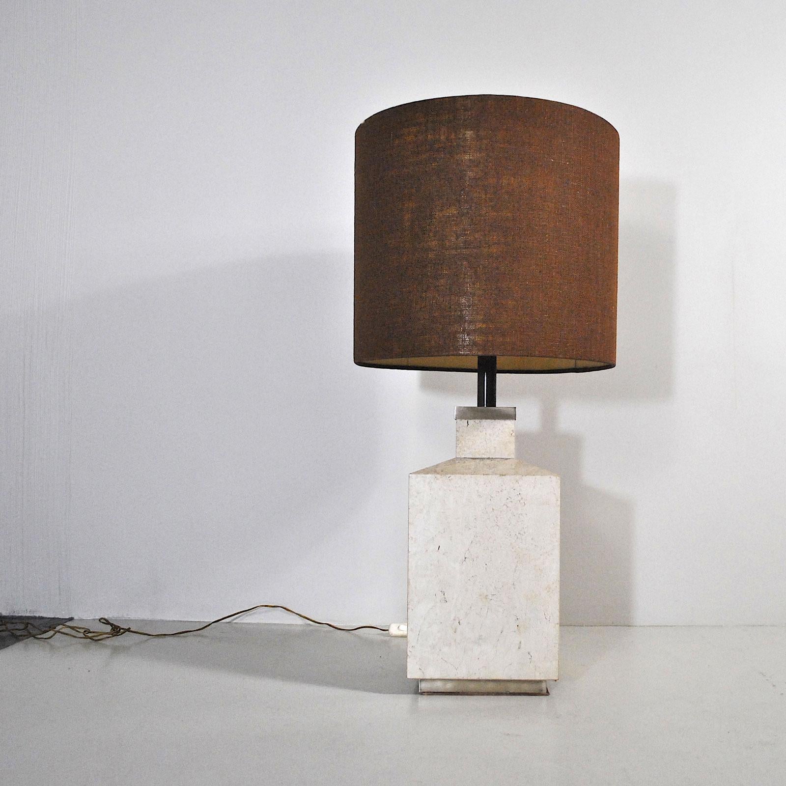 A particular floor lamp in travertine marble and steel base.


The lamp is sold together with the original lampshade which shows light signs of wear. We are able to create lampshades of any shape, size and color.