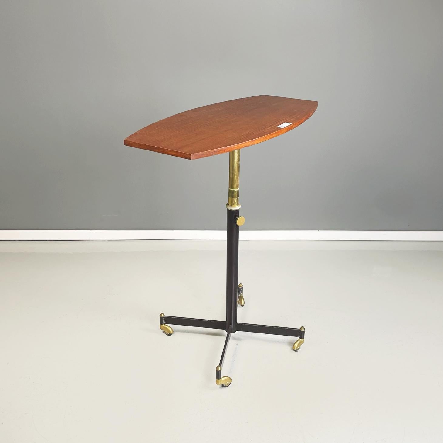 Italian midcentury table with adjustable wooden top withe metal and brass 1950s.
Table with adjustable wooden top and black painted metal and brass structure. 4 spokes base on wheels. It can be used as a serving table or side coffee table.
It came