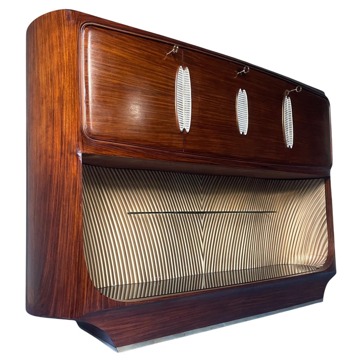 Discover the timeless elegance of this bar cabinet designed by Vittorio Dassi in the 1950s for Palazzi dell’Arte Cantù This exquisite piece of furniture is a testament to Italian craftsmanship and the innovative design of the era The cabinet