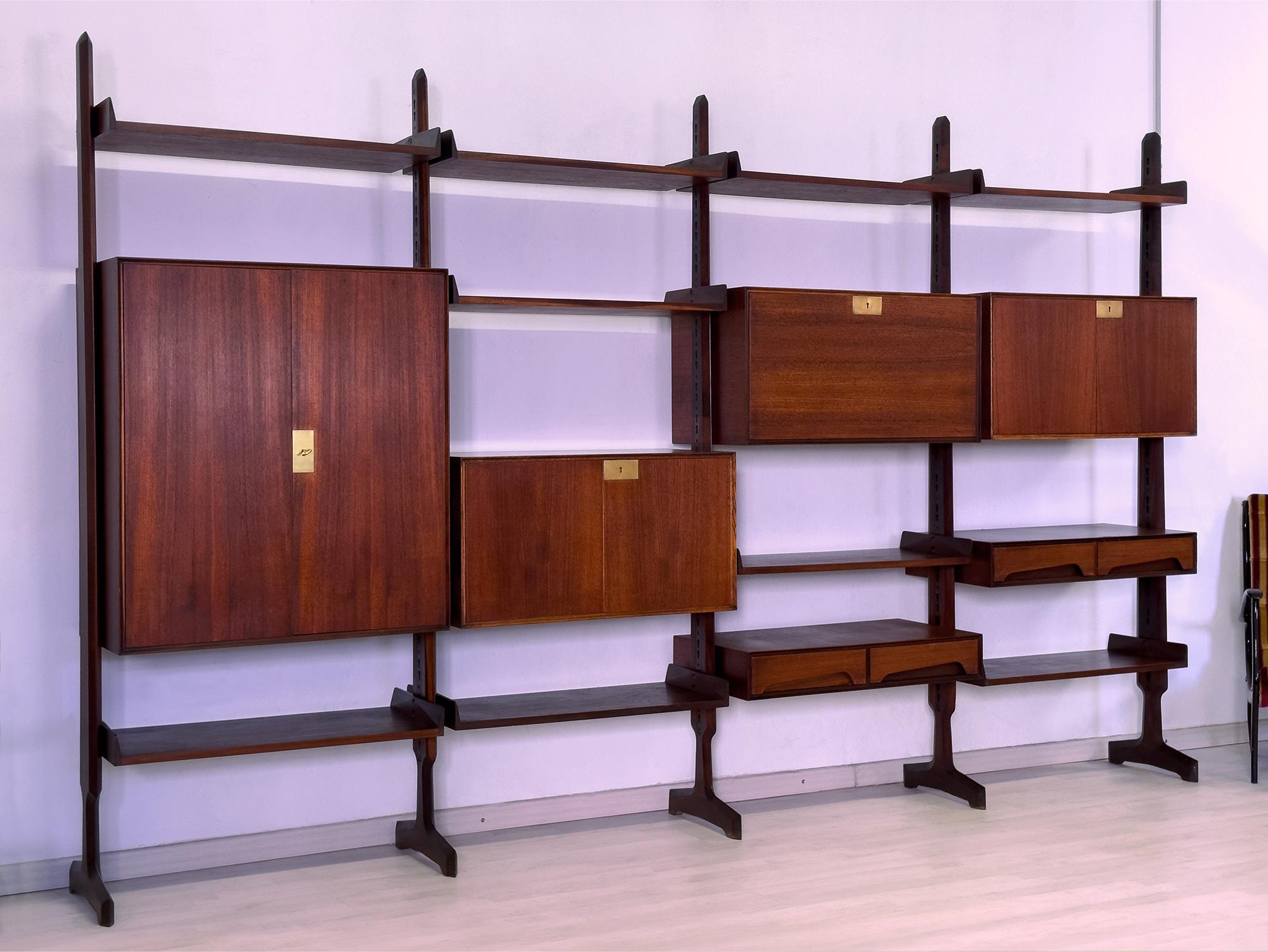 This bookcase consists of four modules freestanding, suitable to be moving and placed at will in the home.

It's composed by #5 uprights, and equipped with #9 shelves, #2 cabinets two doors, #2 cabinets with two drawers each one, #1 big cabinet two