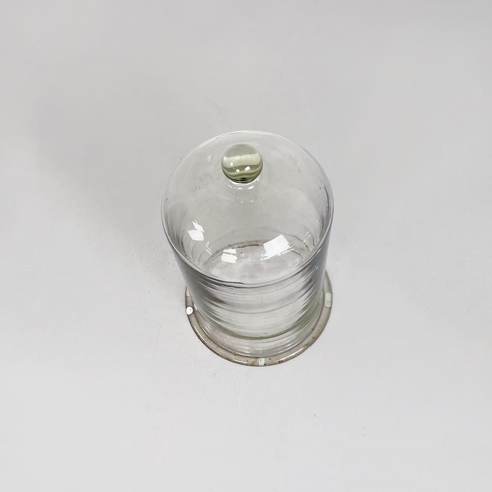Italian mid-century thick glass bell, 1960s
Glass bell with a round base. On the top it has a glass sphere that allows you to raise the bell easily.

We love to use this glass bell for the plant in the winter, when is very cold and the plant need to