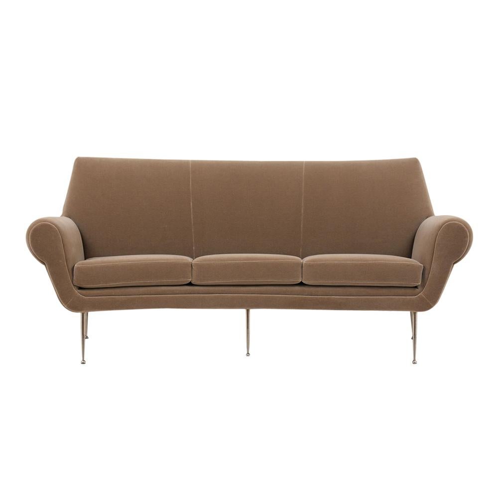 This 1960s Italian Modern Curved Sofa is newly restored and has been professionally upholstered in a new sand color mohair velvet fabric. The loveseat comes with three removable seats with topstitch details, comfortable new foam inserts, rounded