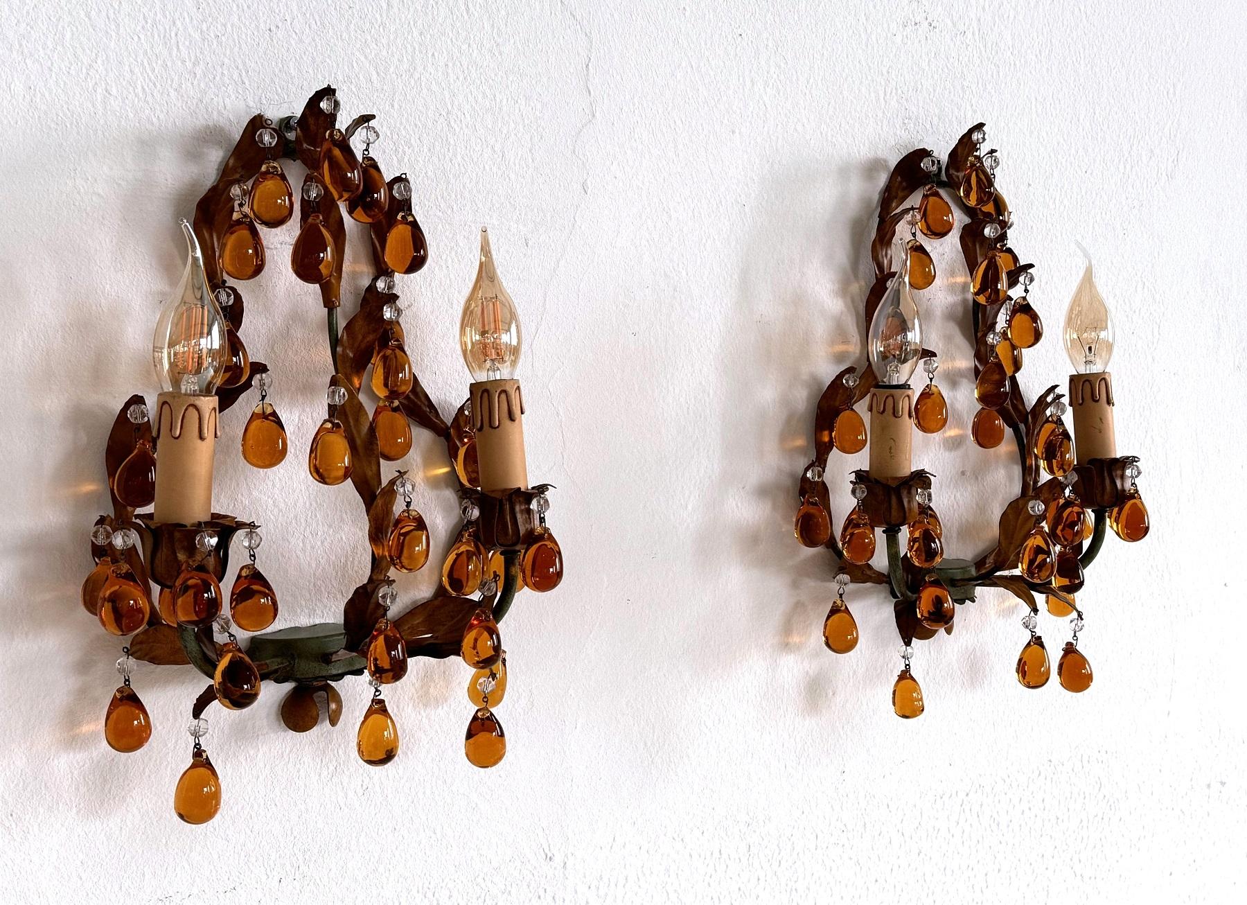 Gorgeous pair of antique Italian wall sconces made of tole - metal and equipped with beautiful thick Murano glass drops in amber color.
Both wall sconces are in very good and clean condition despite their age, all drops are in perfect shape - we did