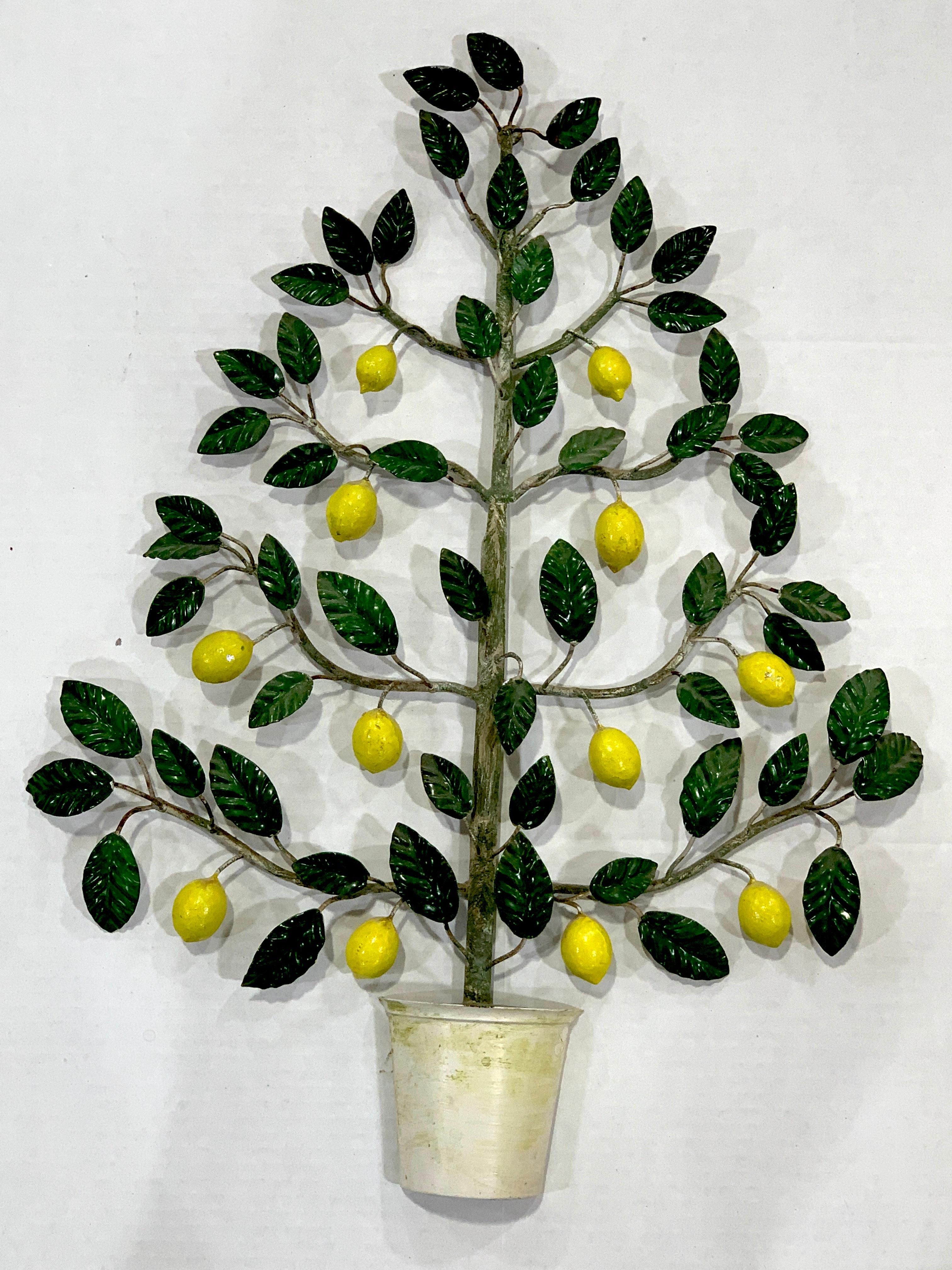 Italian midcentury tole wall sculpture of a lemon tree, beautifully painted, a three dimensional sculpture of a potted lemon topiary
Lemon tree measures: 25.5 x 18 x 2.