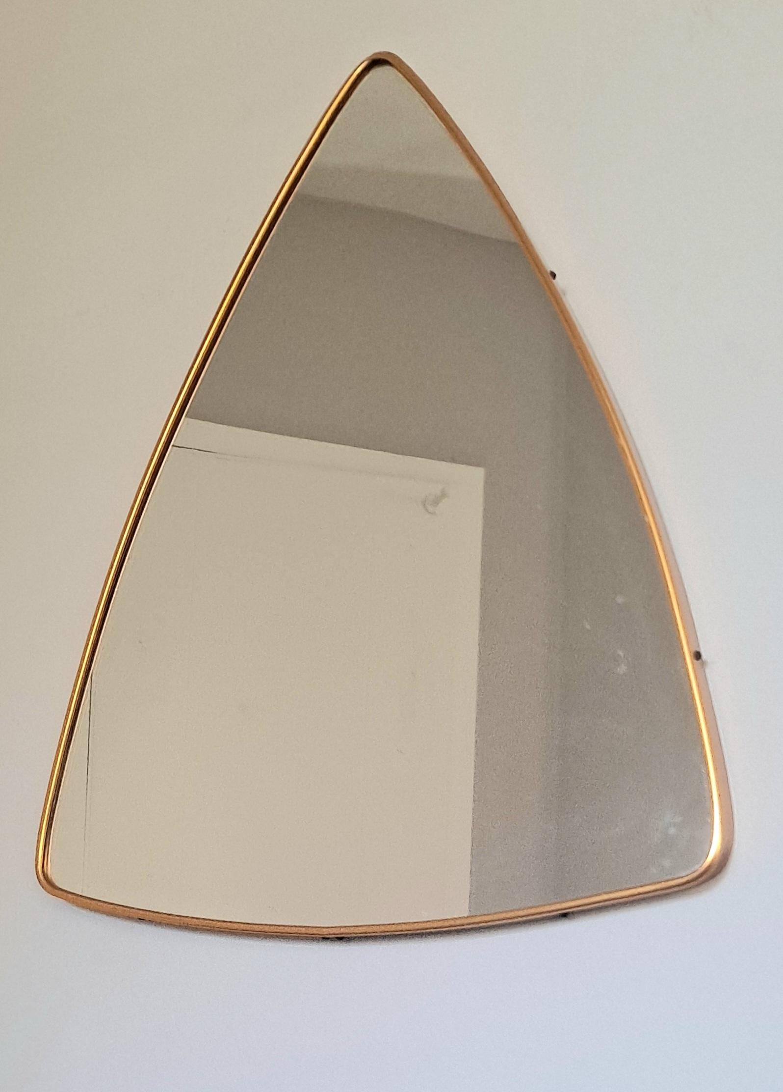 Aluminum base triangle wall mirror. Frame is Brass color.