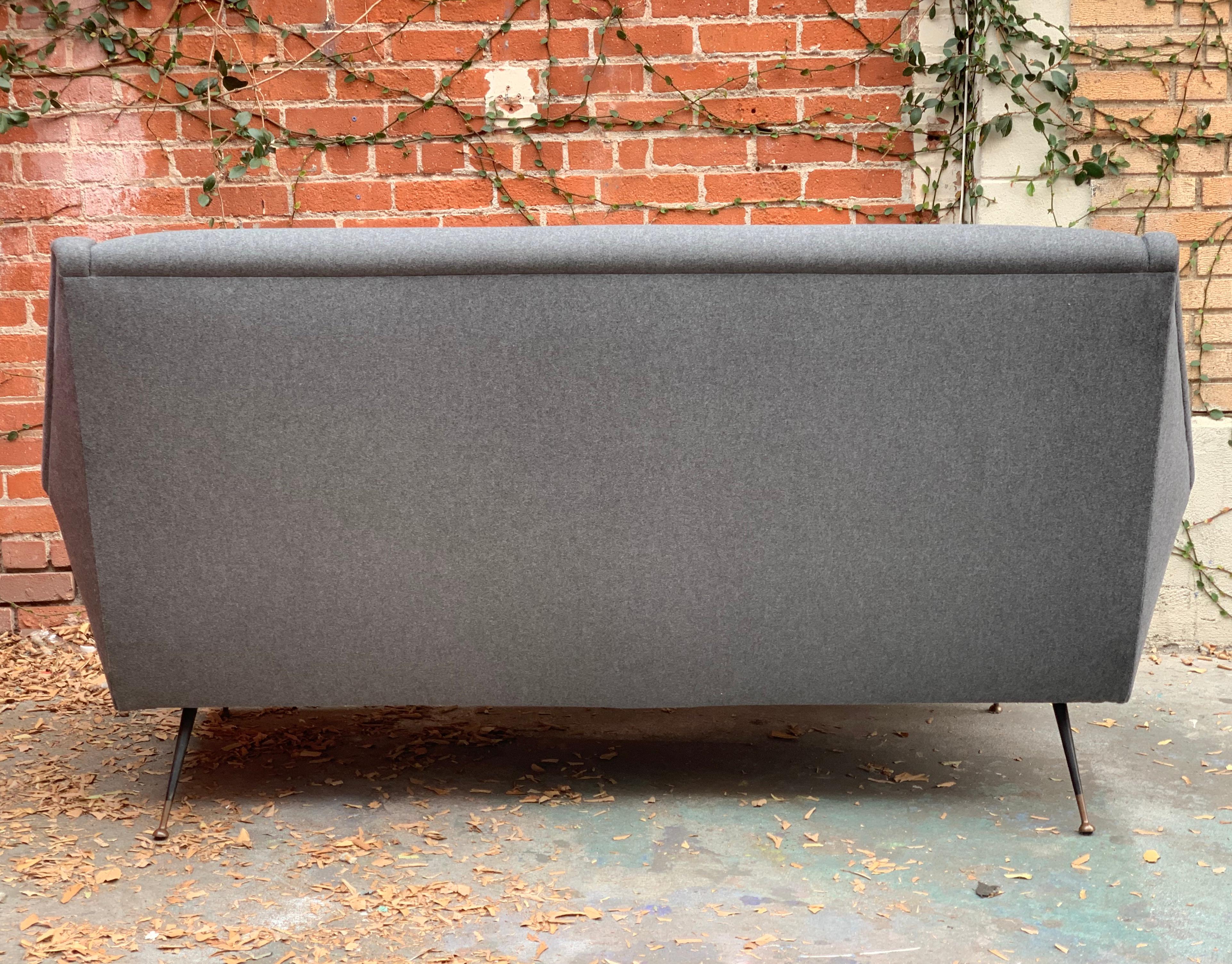 Impeccably restored Italian midcentury tufted sofa by Ico Parisi in new Grey Flannel.
Matching pair of chairs available.