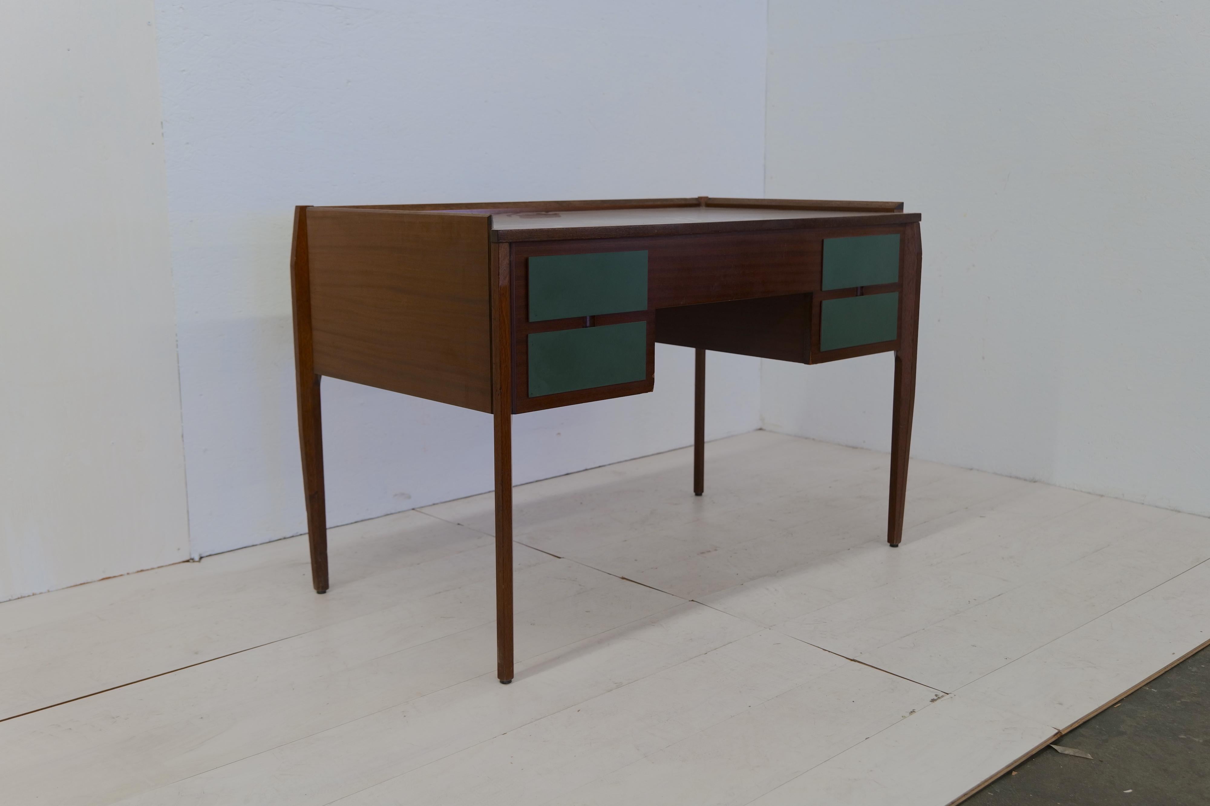 The Italian midcentury Vittorio D'assi desk from the 1960s is a stunning example of functional elegance. Designed by Vittorio D'assi, this desk showcases a harmonious blend of sleek lines and refined craftsmanship. Crafted with high-quality