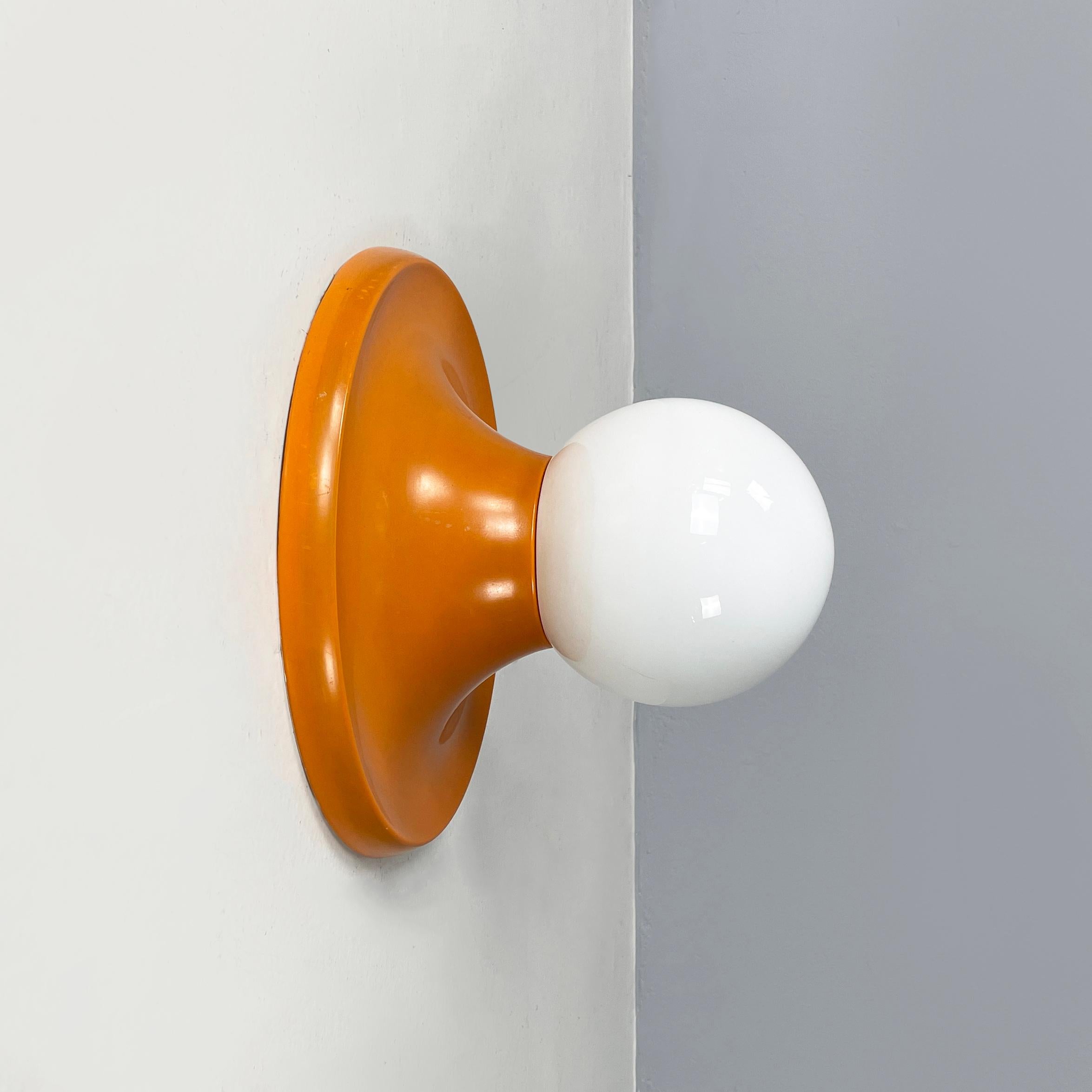 Italian mid-century modern Wall light Light Ball by Castiglioni brothers for Flos 1960s
Elegant wall or ceiling lamp mod. Light Ball with spherical opaline glass diffuser. The round base structure is in orange enamelled metal.
Produced by Flos in