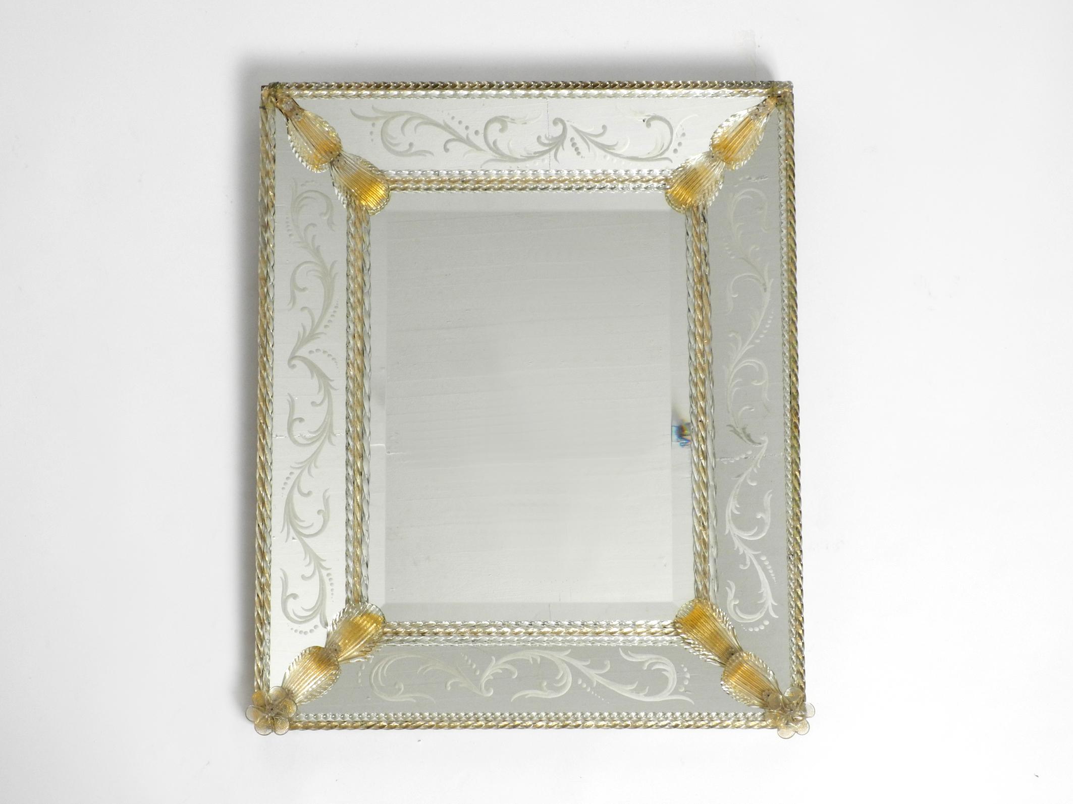 Very rare, stunning beautiful Italian midcentury wall mirror with an elaborate Murano glass frame.
Manufacturer is Barovier & Toso. Made in Italy
Very high-quality workmanship with individual Murano glass rods and leaves.
The inner mirror is