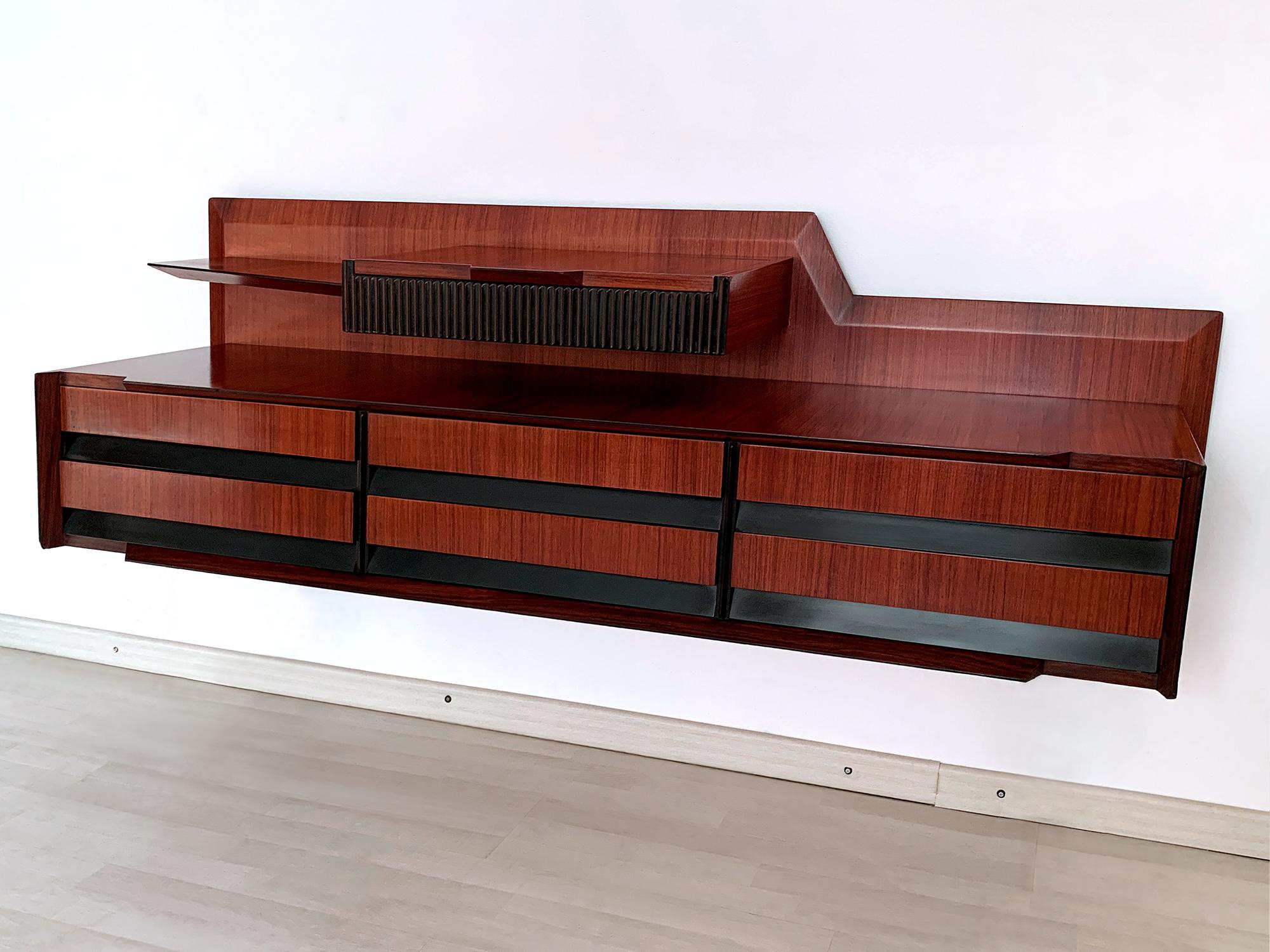 Stunning very rare Italian wall mounted Sideboard and/or Chest of drawers, very well designed by Vittorio Dassi in the 1950s, crafted with a gorgeous material like as warm teak wood.

All items designed and manufactured by Vittorio Dassi are always
