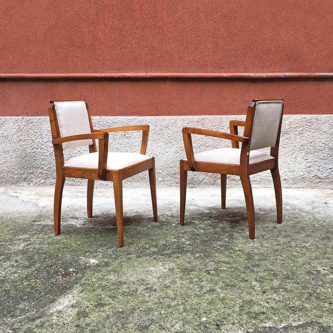 Italian mid-century walnut armchairs with armrests and new padded, 1930s 
Walnut armchairs with armrests, with new padded seat and back and covered in cotton, original trimmings on the perimeter. 

Entirely restored, perfect