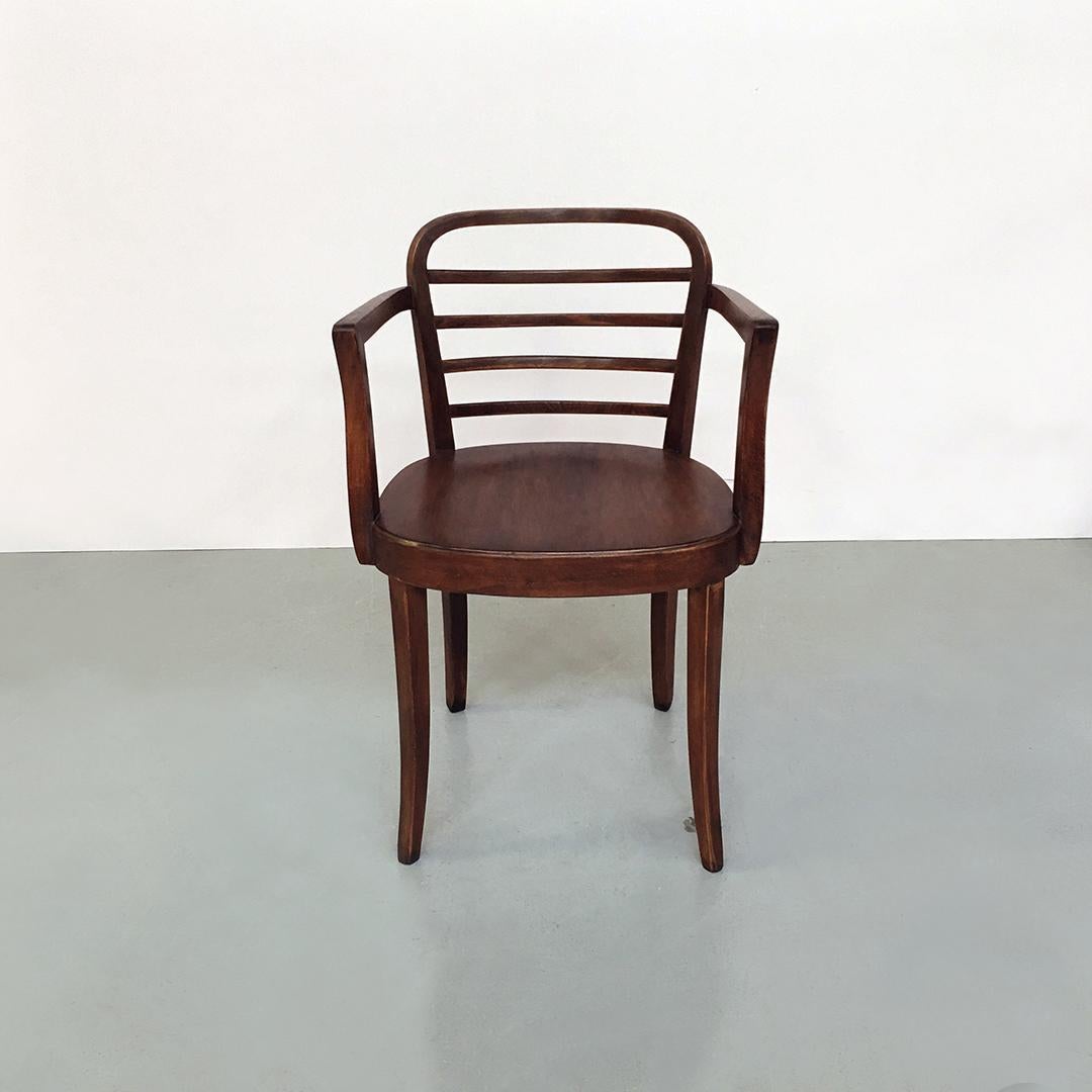 Italian midcentury walnut chair with armrests by Bellotti Brothers, 1950s
walnut chair with armrests, square section legs, backrest with curved strips and brass rod on the back of the seat with embossed logo, visible in the photo.
Produced by the