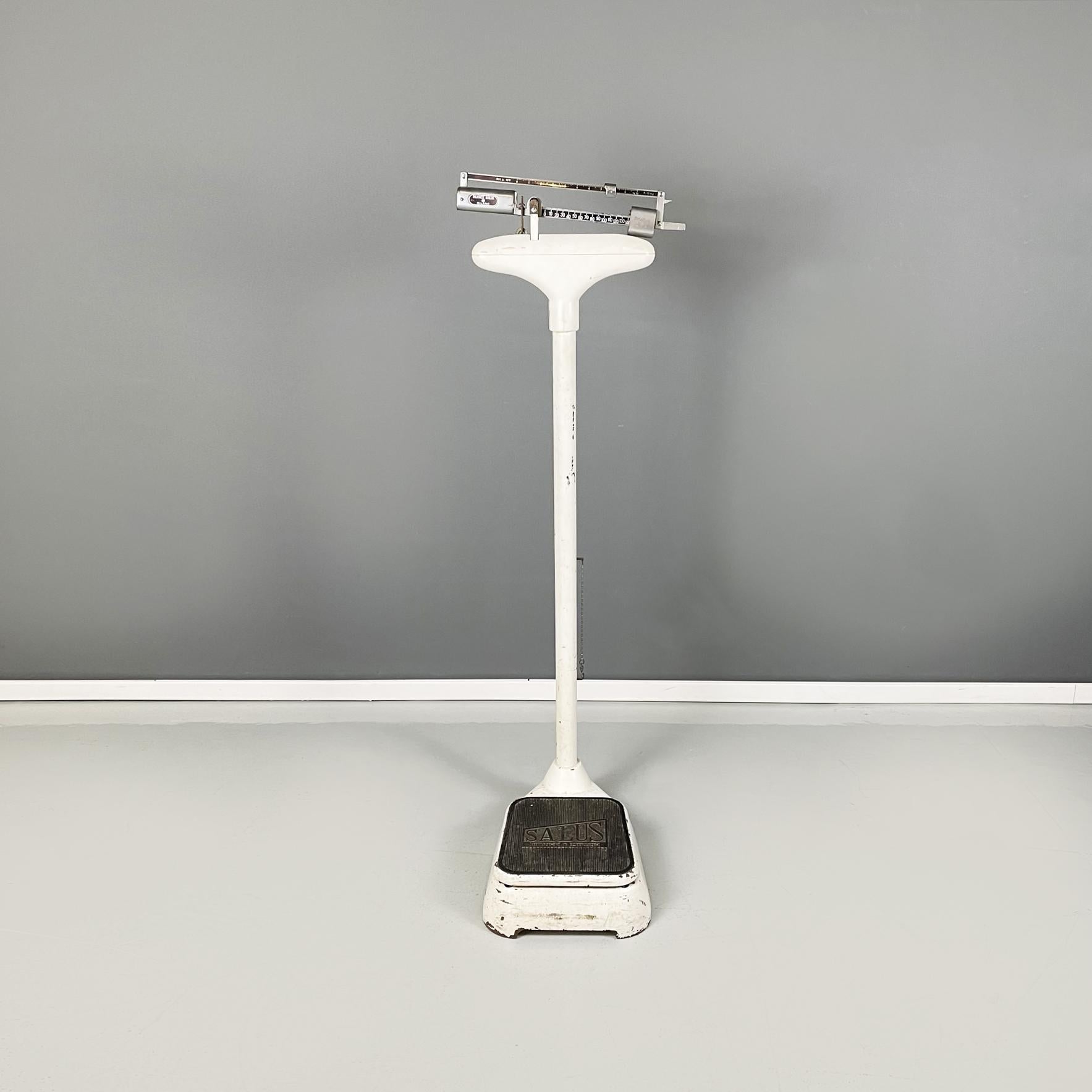 Italian mid-century White metal Vertical medical scale by Salus, 1960s
Vertical medical scale in white painted metal. In the upper part it has a metal balance wheel. In the lower part it has the black squared platform where to place the