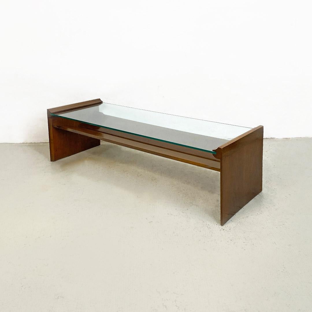 Italian Mid-Century Modern wood and green glass coffee table with two floors mod. Acca, designed by Kazuhide Takahama for Gavina, 1960s
Rectangular wooden coffee table, with moldings and grooves inside the sides where the sea green glass top fits